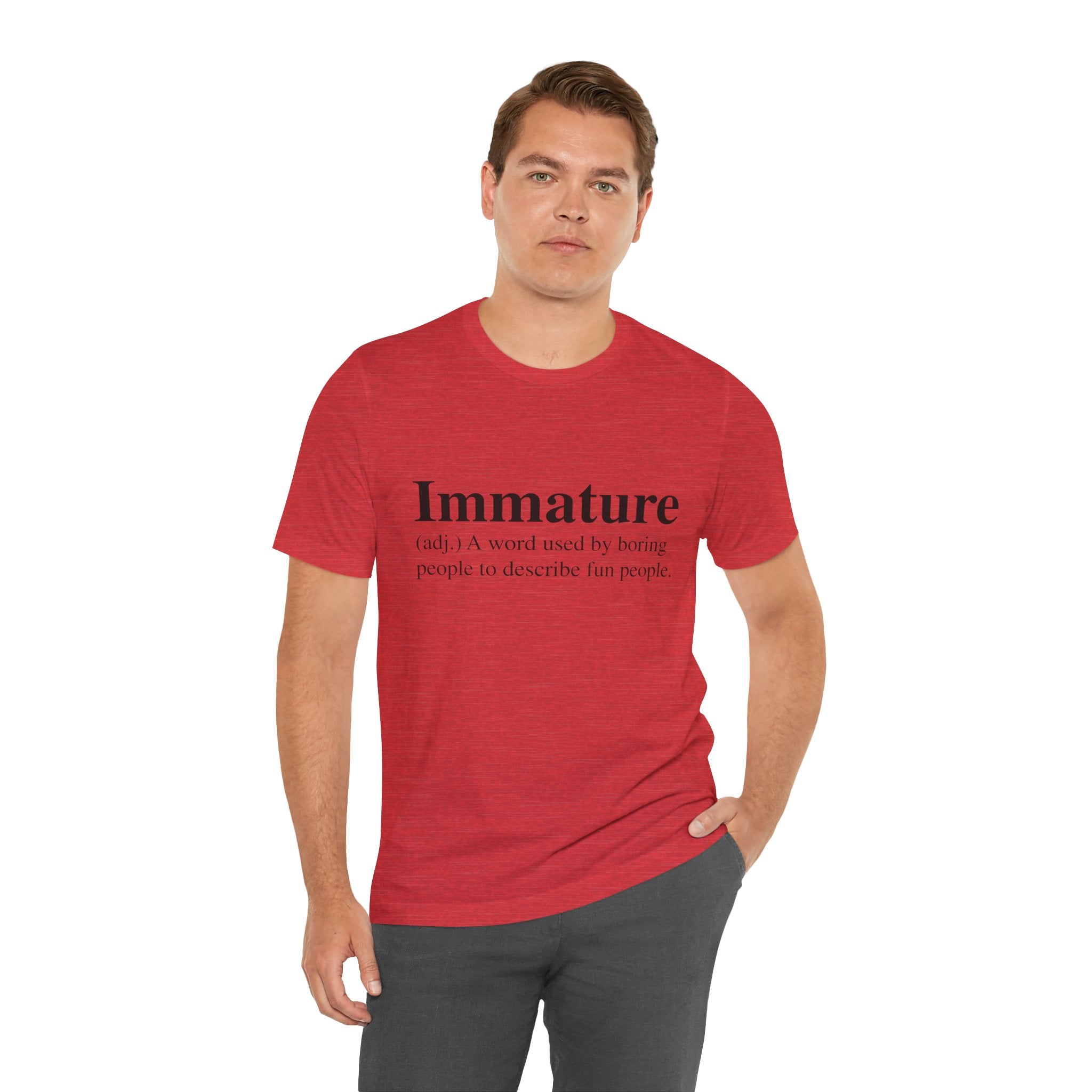 Man standing wearing a red unisex Immature T-Shirt tee with the text "Immature T-Shirt: a word used by boring people to describe fun people" printed on it.