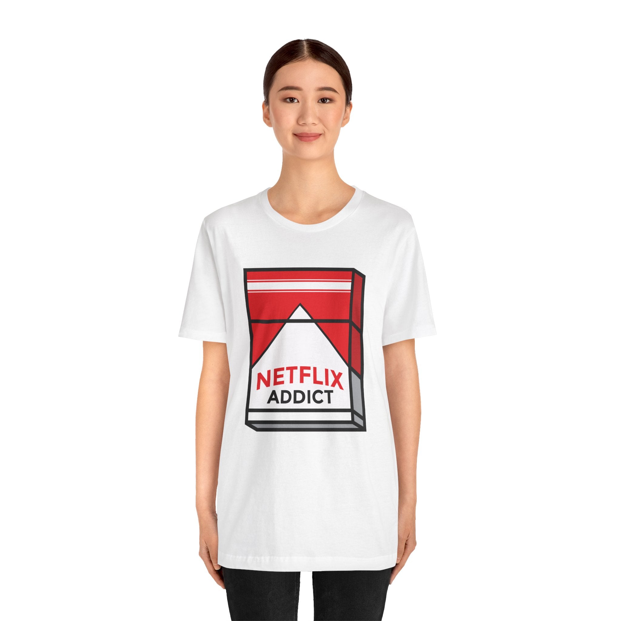 A young woman wearing a Netflix Addict unisex jersey tee with a red and black triangle design.