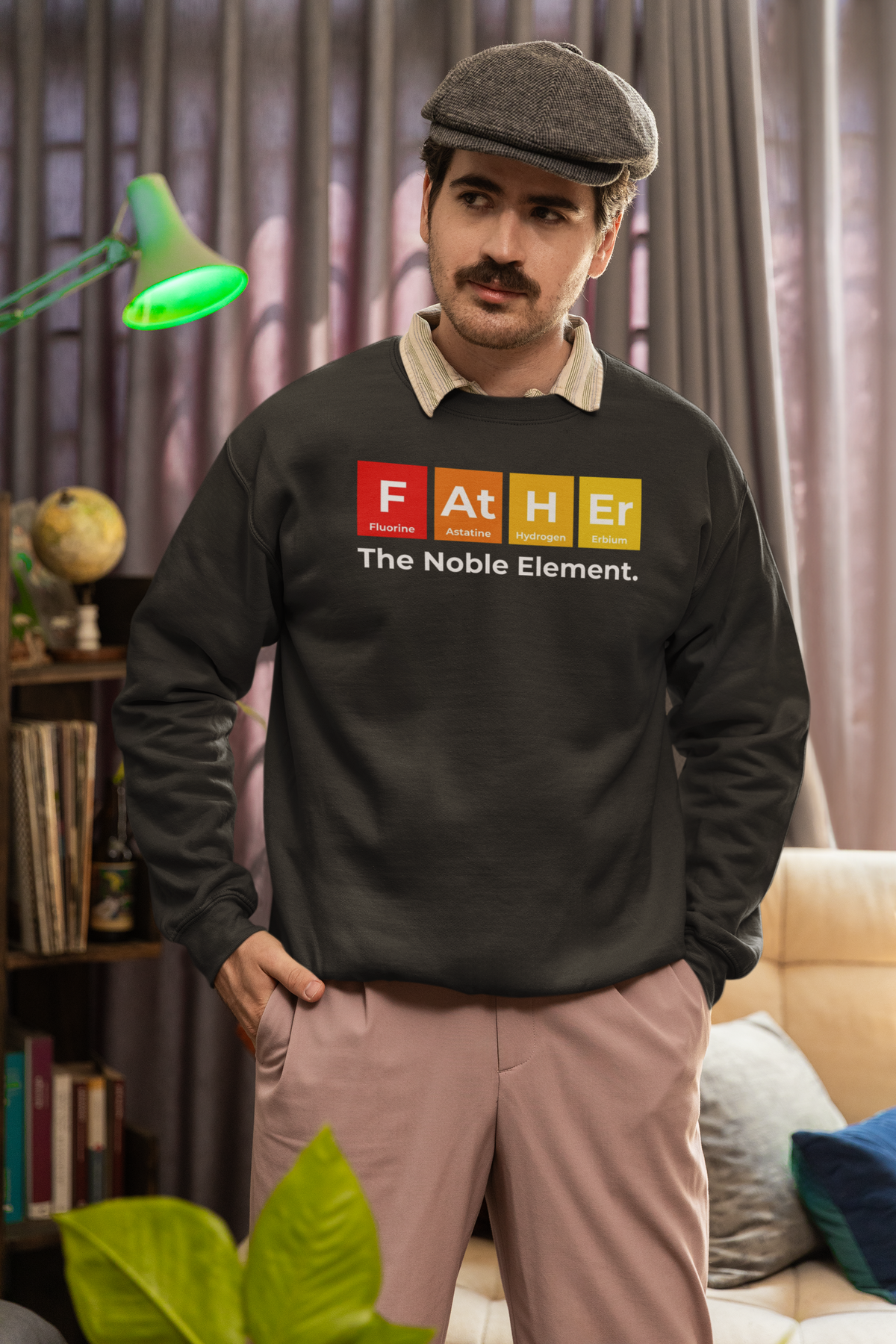 'Father: The Noble Element' sweatshirt in charcoal, man wearing it indoors, funny periodic table gift