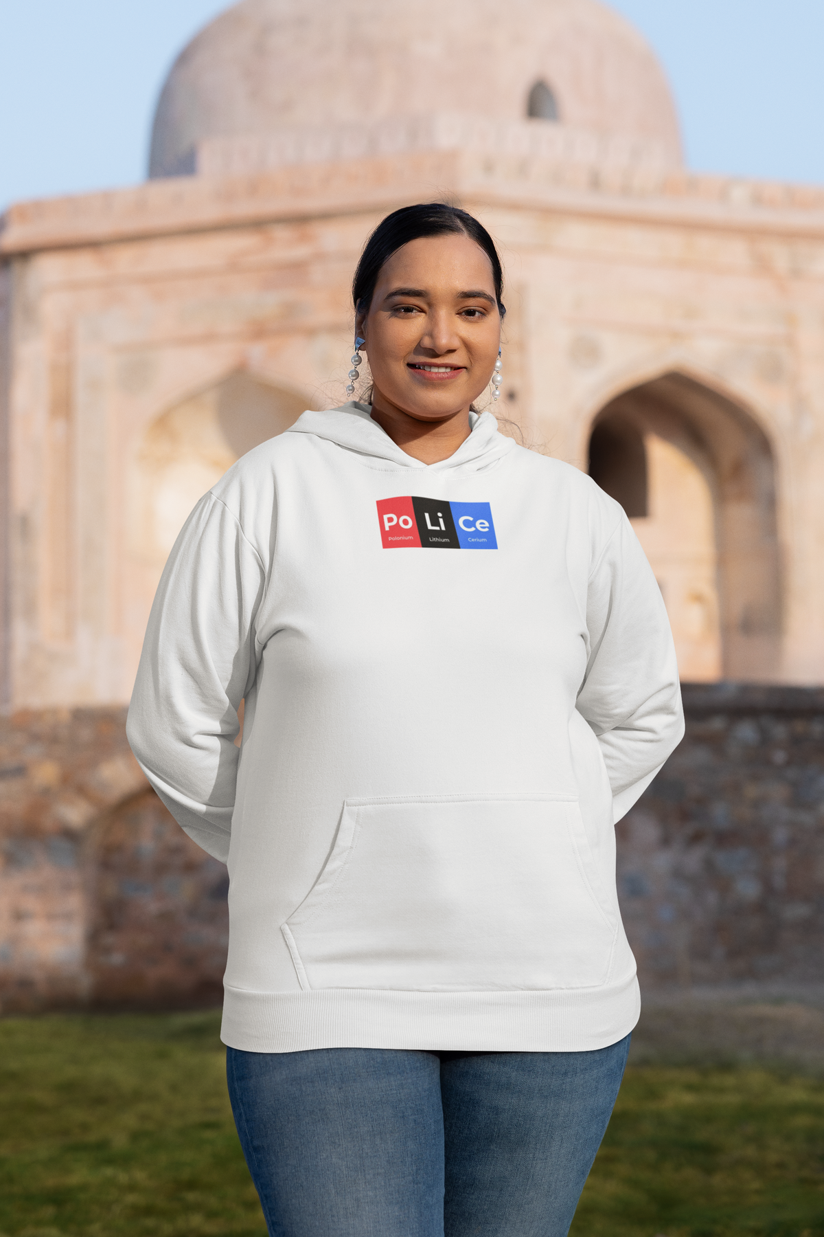 'Po-Li-Ce Periodic Table Hoodie' in white, woman at a historic monument, Hoodie mockup, Geekpsters