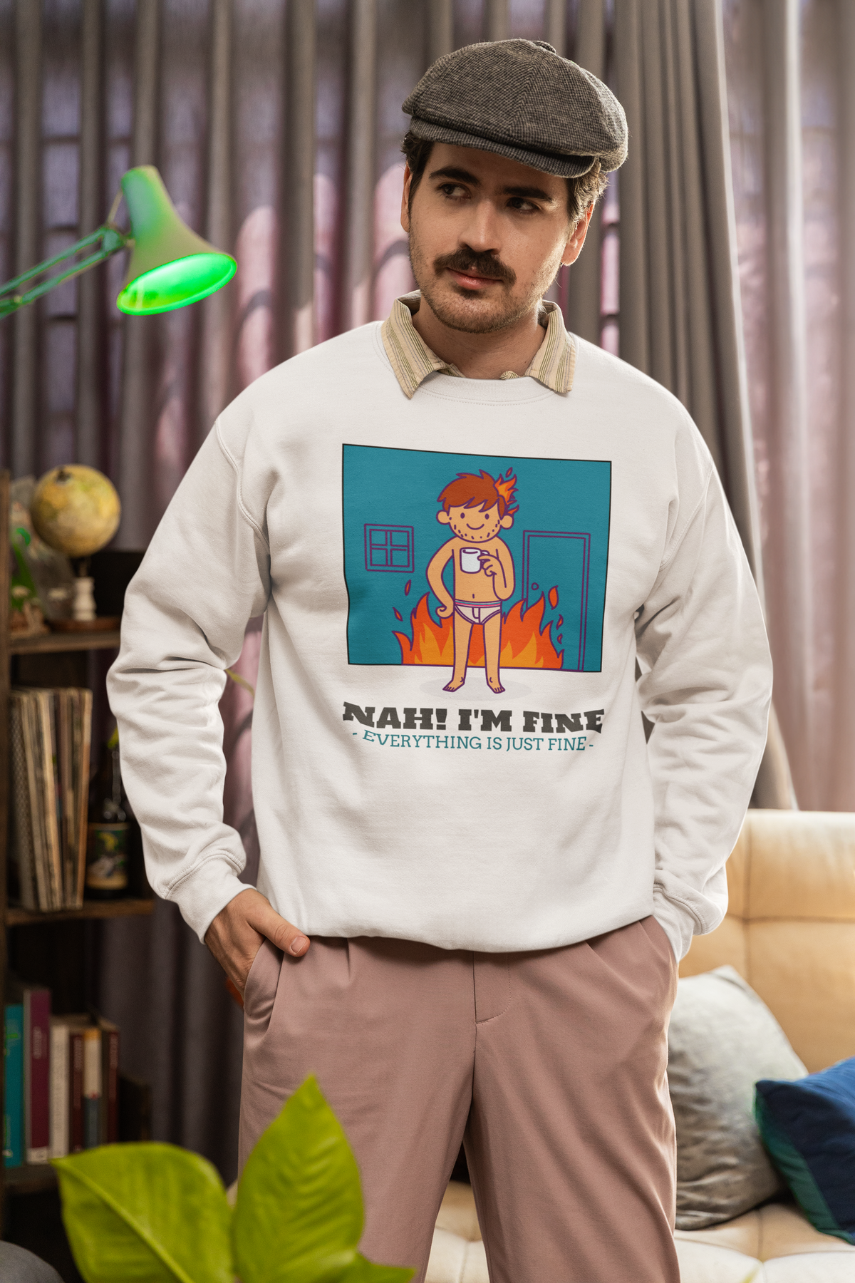 'Nah! I'm Fine' this is fine meme sweatshirt in cream, man wearing it indoors, funny sarcastic gift idea