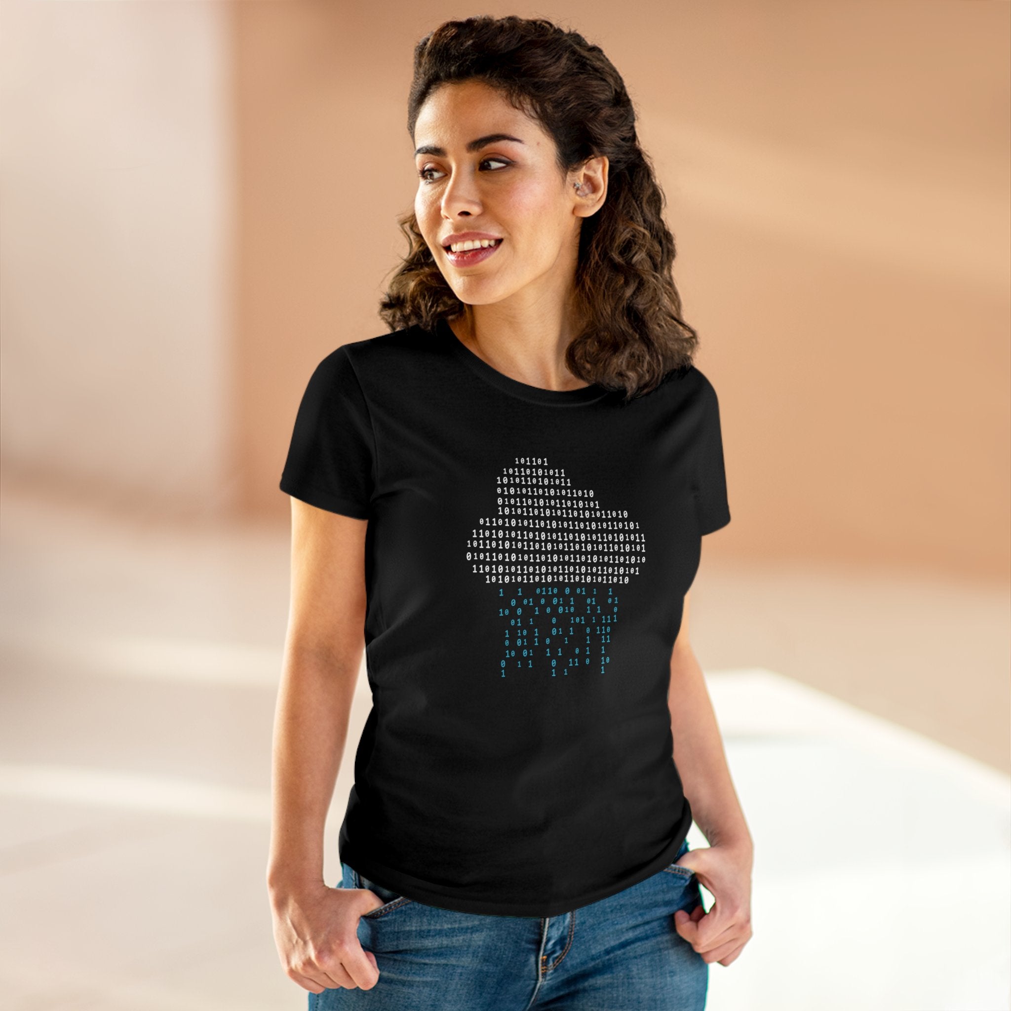 A woman with curly hair is wearing a black Binary Rain Cloud - Women's Tee. She is standing and smiling in a brightly lit indoor space.
