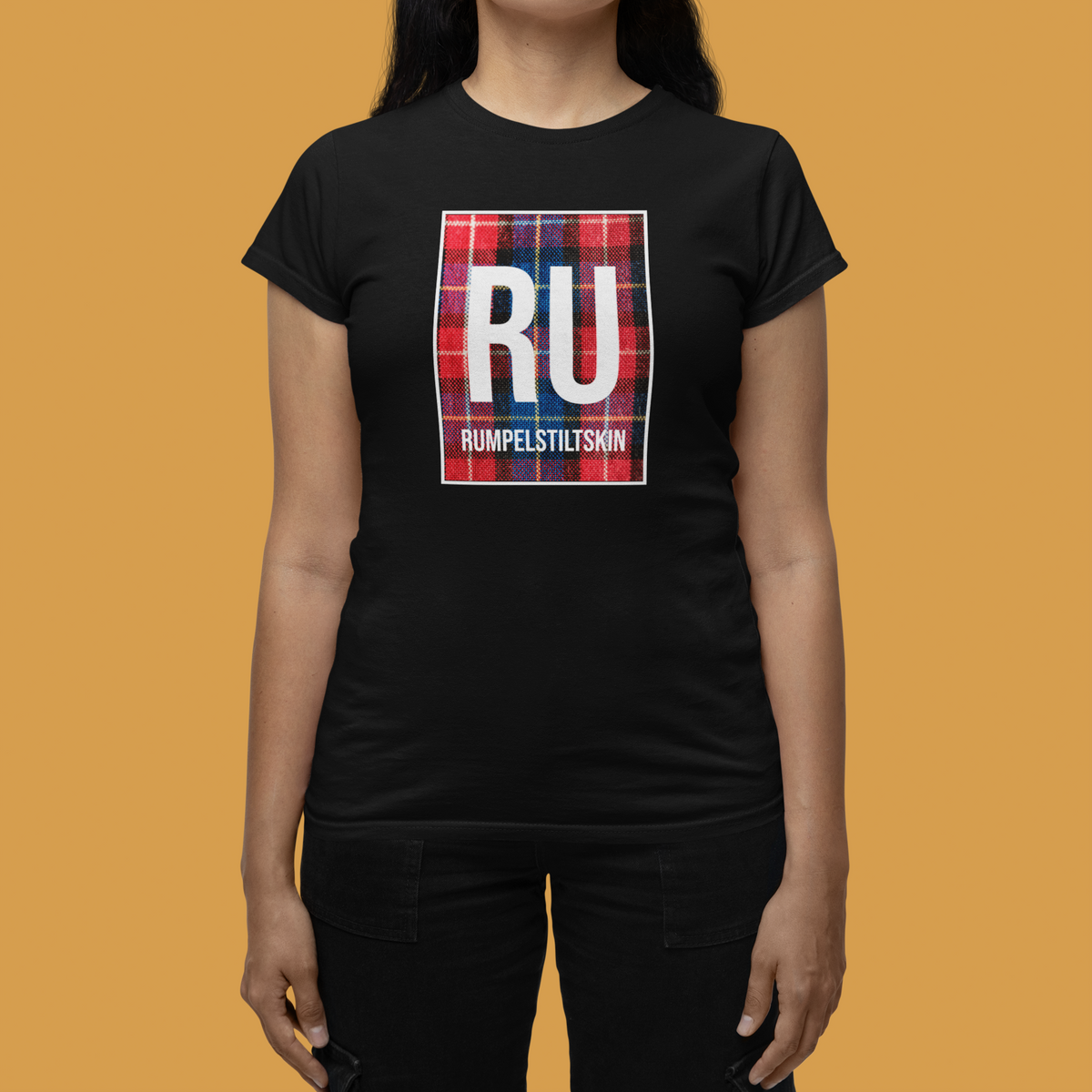 'RU Rumpelstiltskin' periodic table women's tee in black, woman modeling it on orange background, funny gift