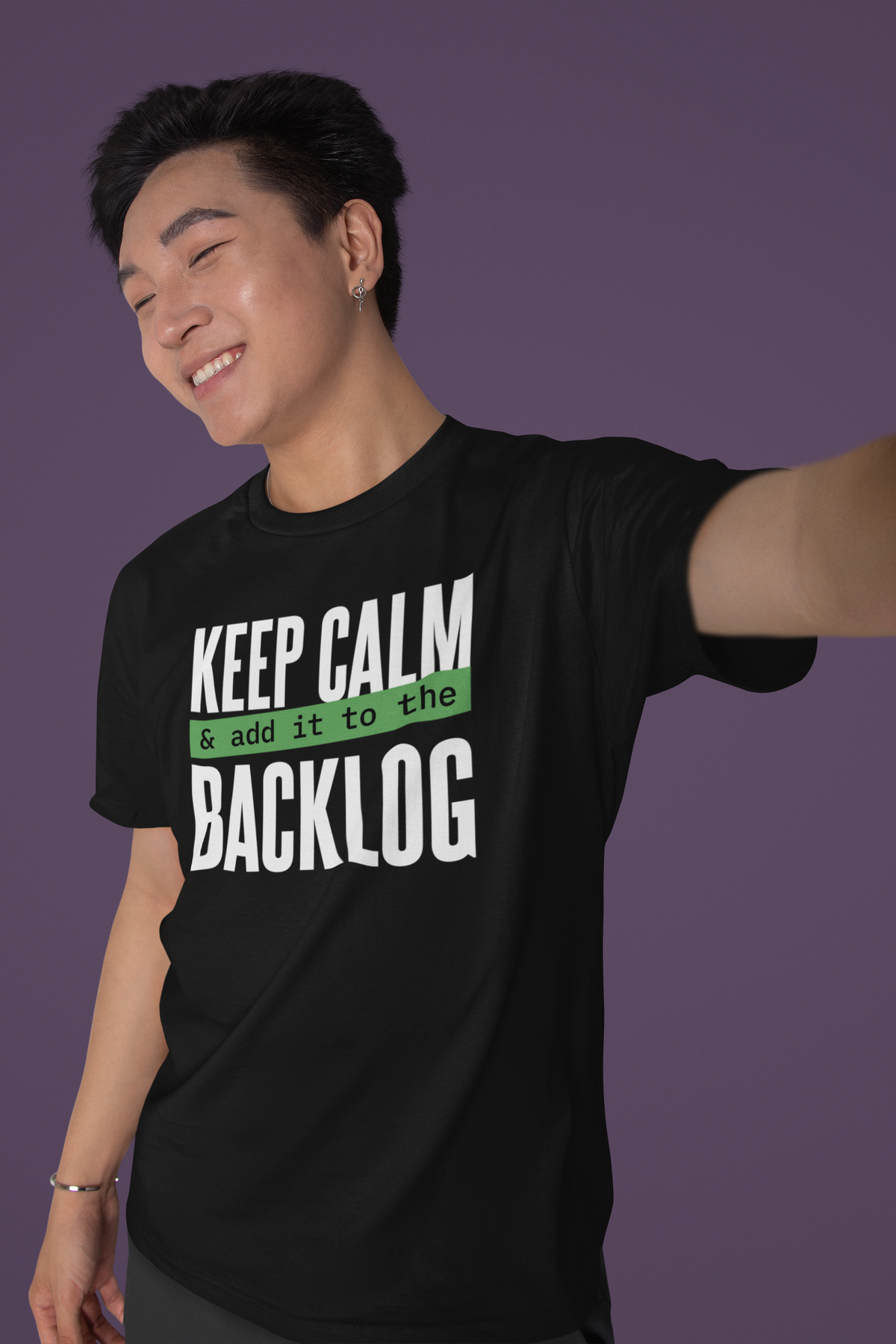 'Keep Calm and Add It to the Backlog' t-shirt in black, man model wearing it and taking a selfie, funny scrum gift shirt