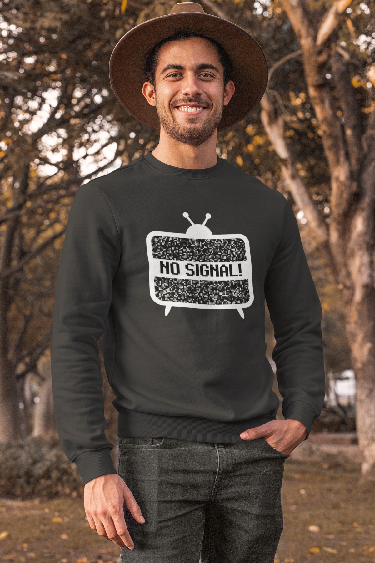 'No Signal' crewneck sweatshirt in charcoal grey, man wearing it outdoors in hat, funny retro TV gift