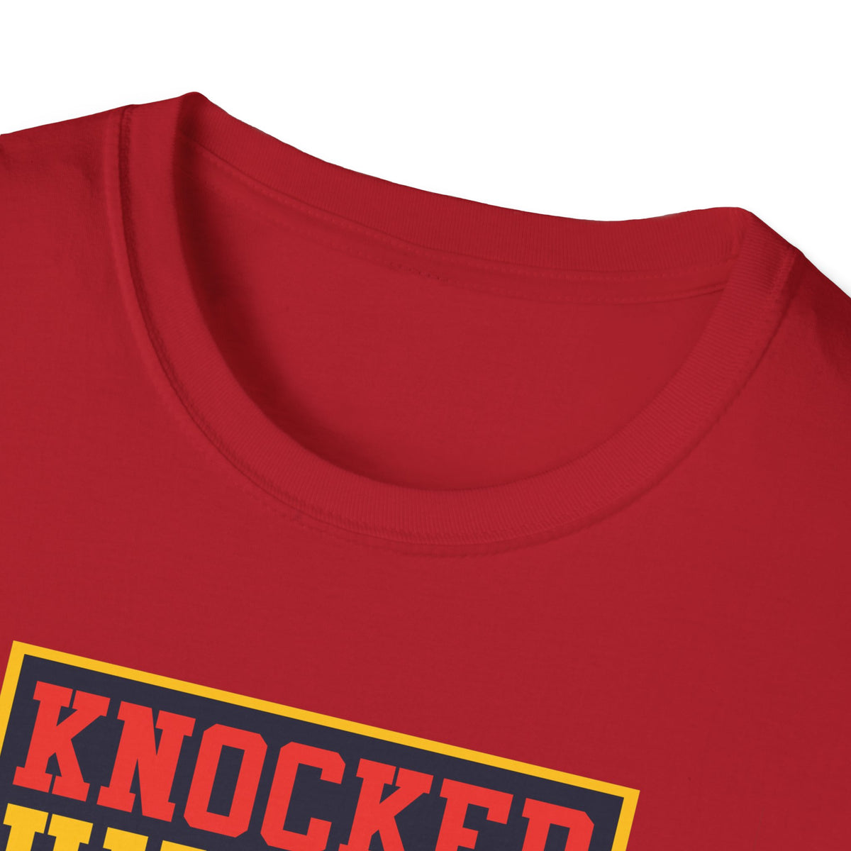 Close-up of "Knocked Him Out" robot boxing print on cherry red t-shirt collar, retro arcade detail