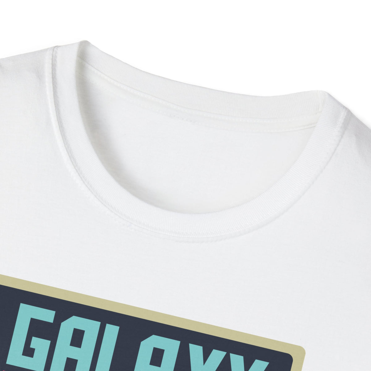 Close-up of "Galaxy Invaders" teal text print on white t-shirt, retro arcade graphic detail