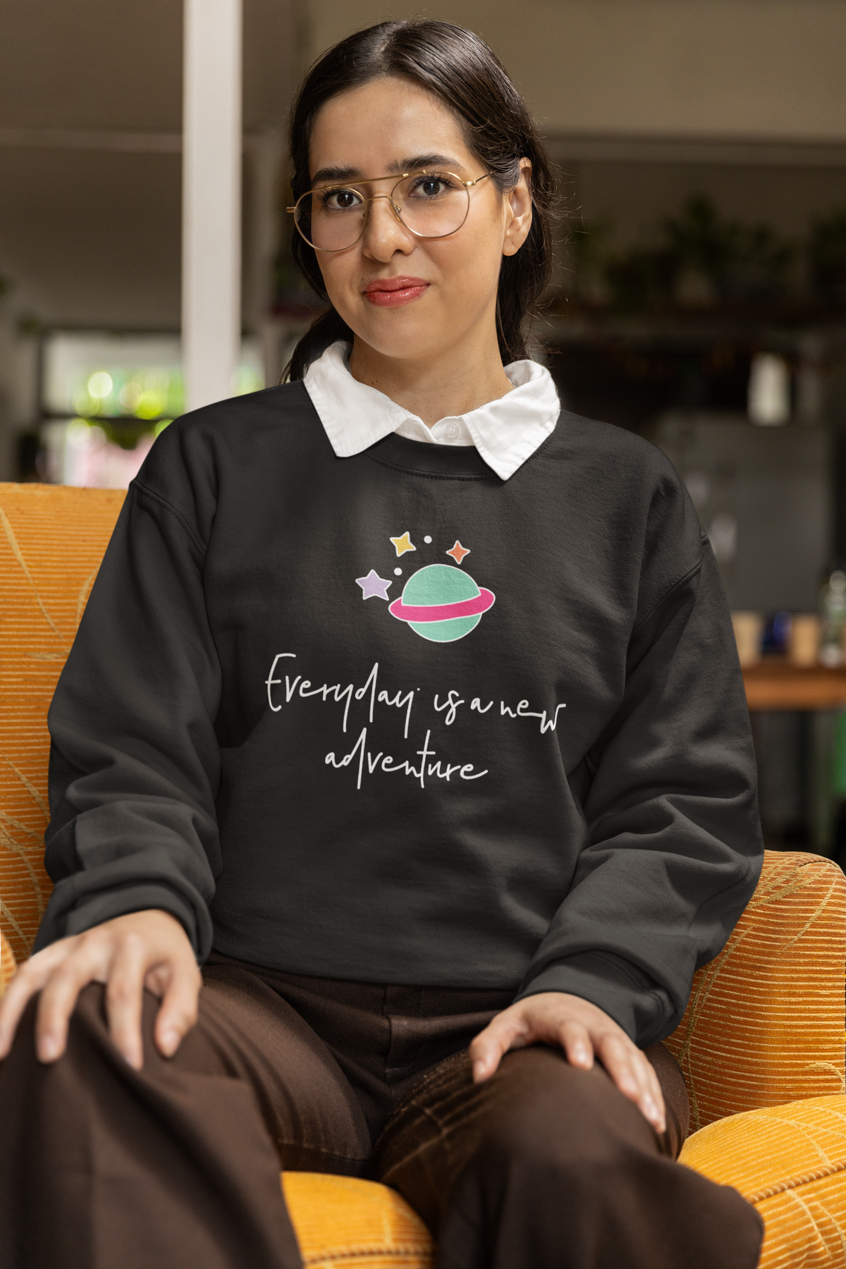 'Everyday is a New Adventure' planet sweatshirt in black, woman wearing it, travel lover gift sweatshirt