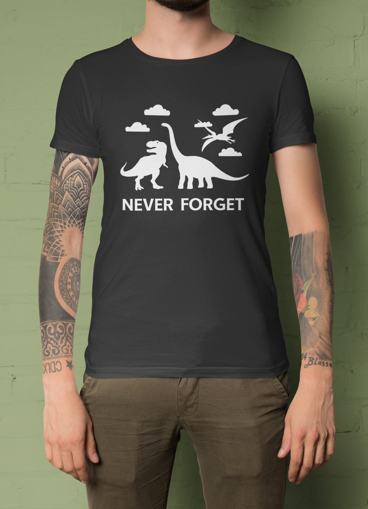 'Never Forget' dinosaur t-shirt in black, man wearing it on green background, funny science gift