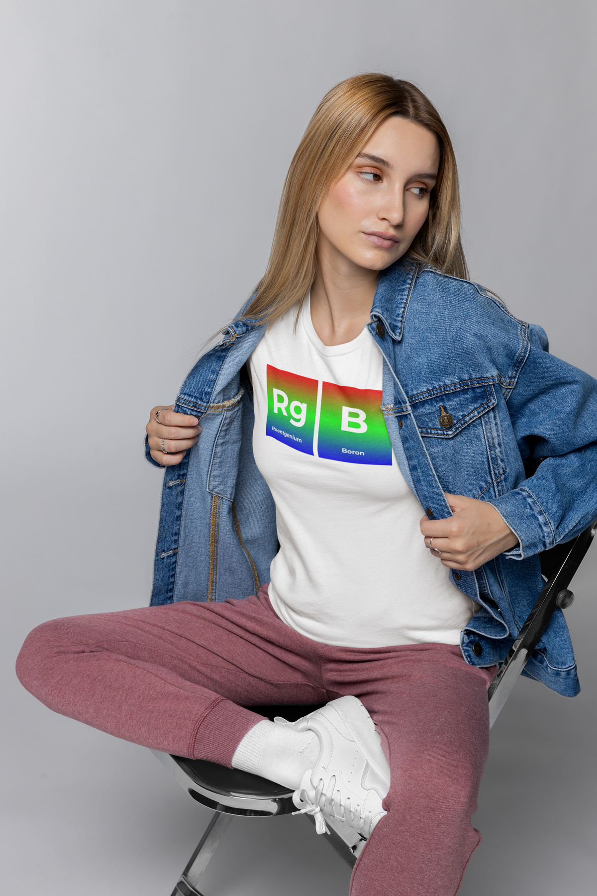 'RG-B' periodic table t-shirt in white, woman in a denim jacket wearing it, funny science pun tee