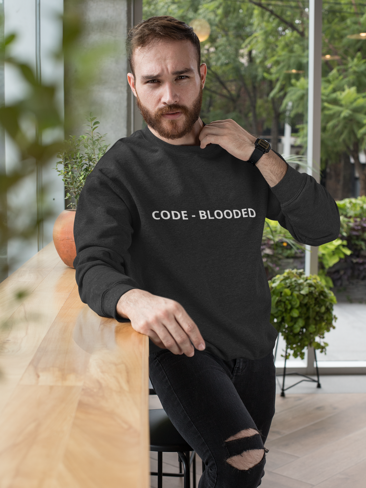 'Code - Blooded' sweatshirt in black, bearded man wearing it outdoors, funny gift for programmers