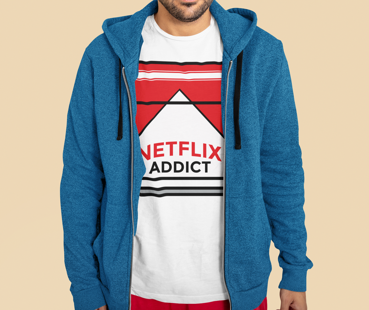 'Netflix Addict' cigarette box parody T-shirt in white, man wearing blue hoodie over it, funny gift tee