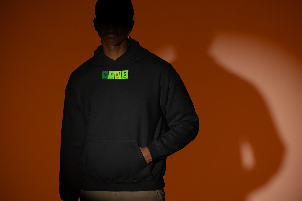 'TE-N-NI-S Periodic Table Hoodie' in black, man under a spotlight, Hoodie mockup, Geekpsters