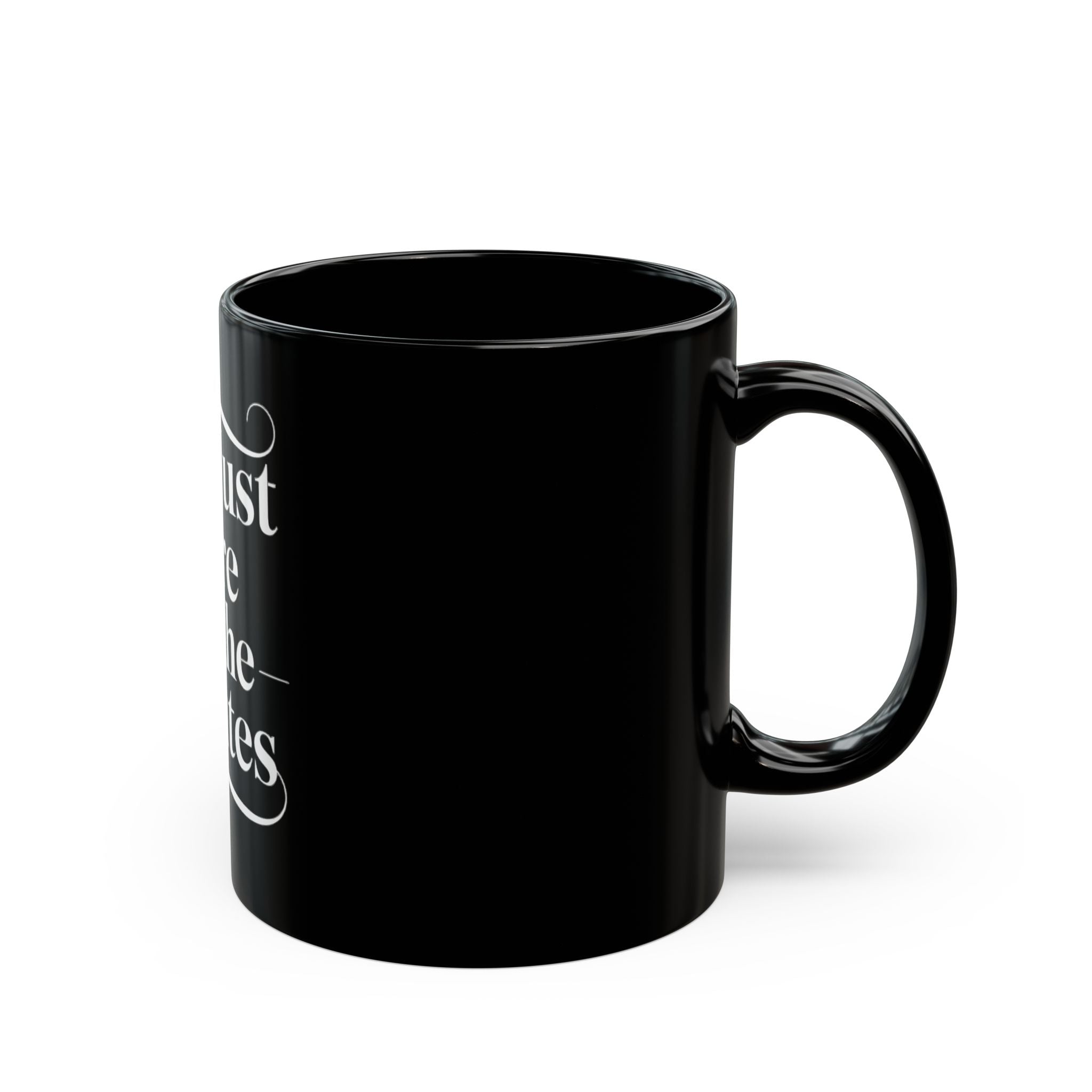 The "I'm just here for the minutes white" Black Mug features glossy black ceramic with bold white text, making it an ideal addition to any cosmic adventure mug collection. Photographed against a plain white background.