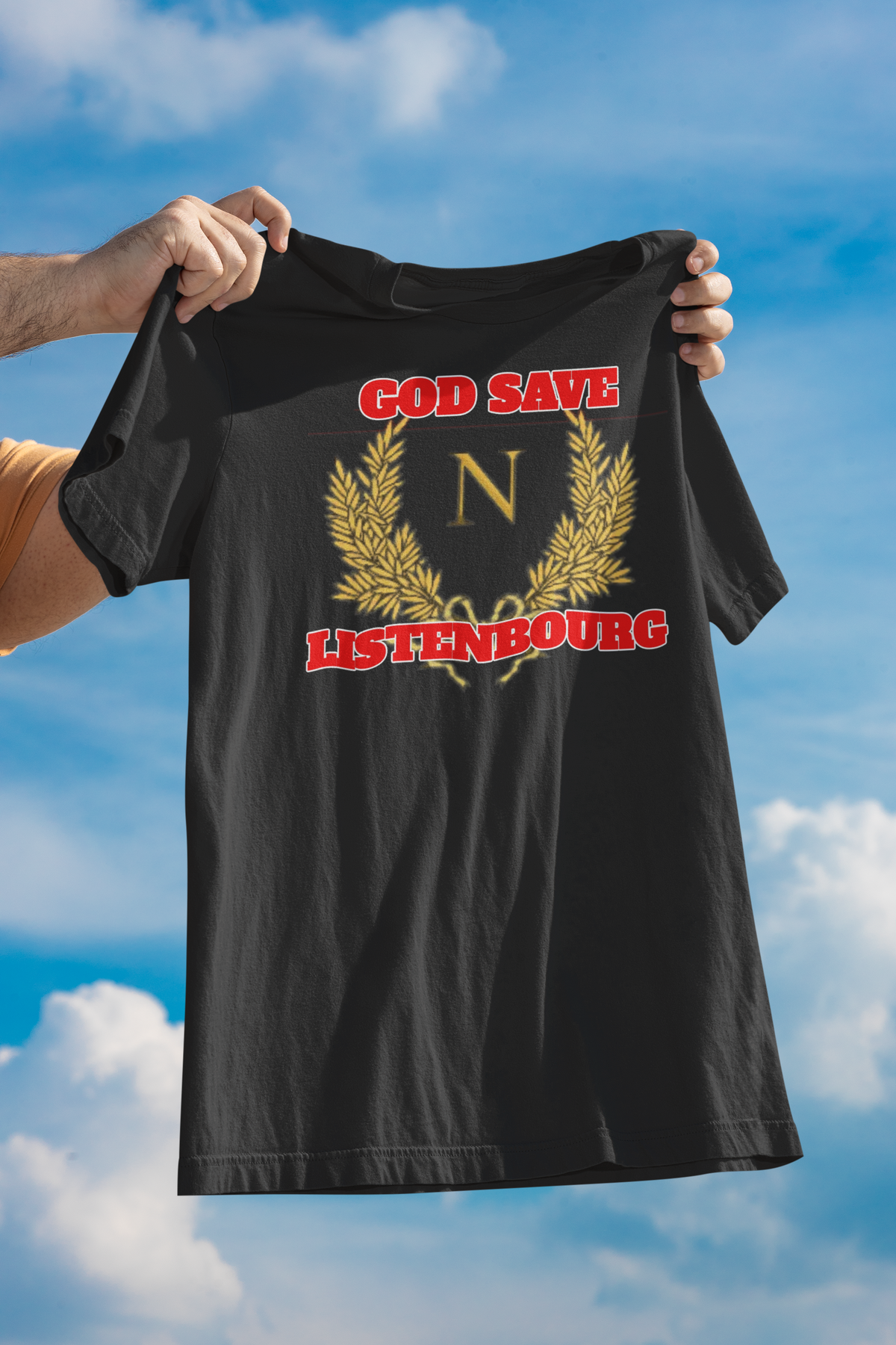 'God Save Listenbourg' t-shirt in black, held up outdoors against a blue sky