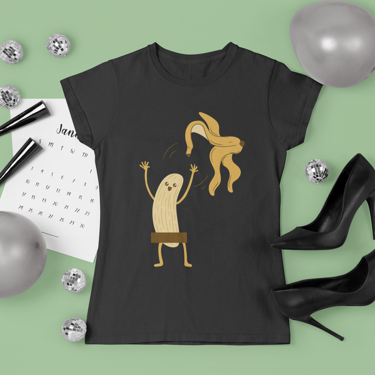 Naked Banana t-shirt in black, flat lay lifestyle setting