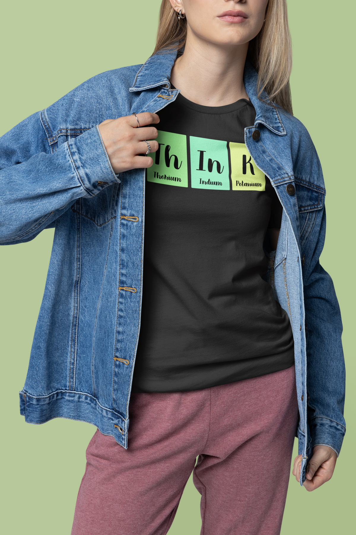 'ThInK' periodic table t-shirt in black, woman wearing it under denim jacket, science pun gift