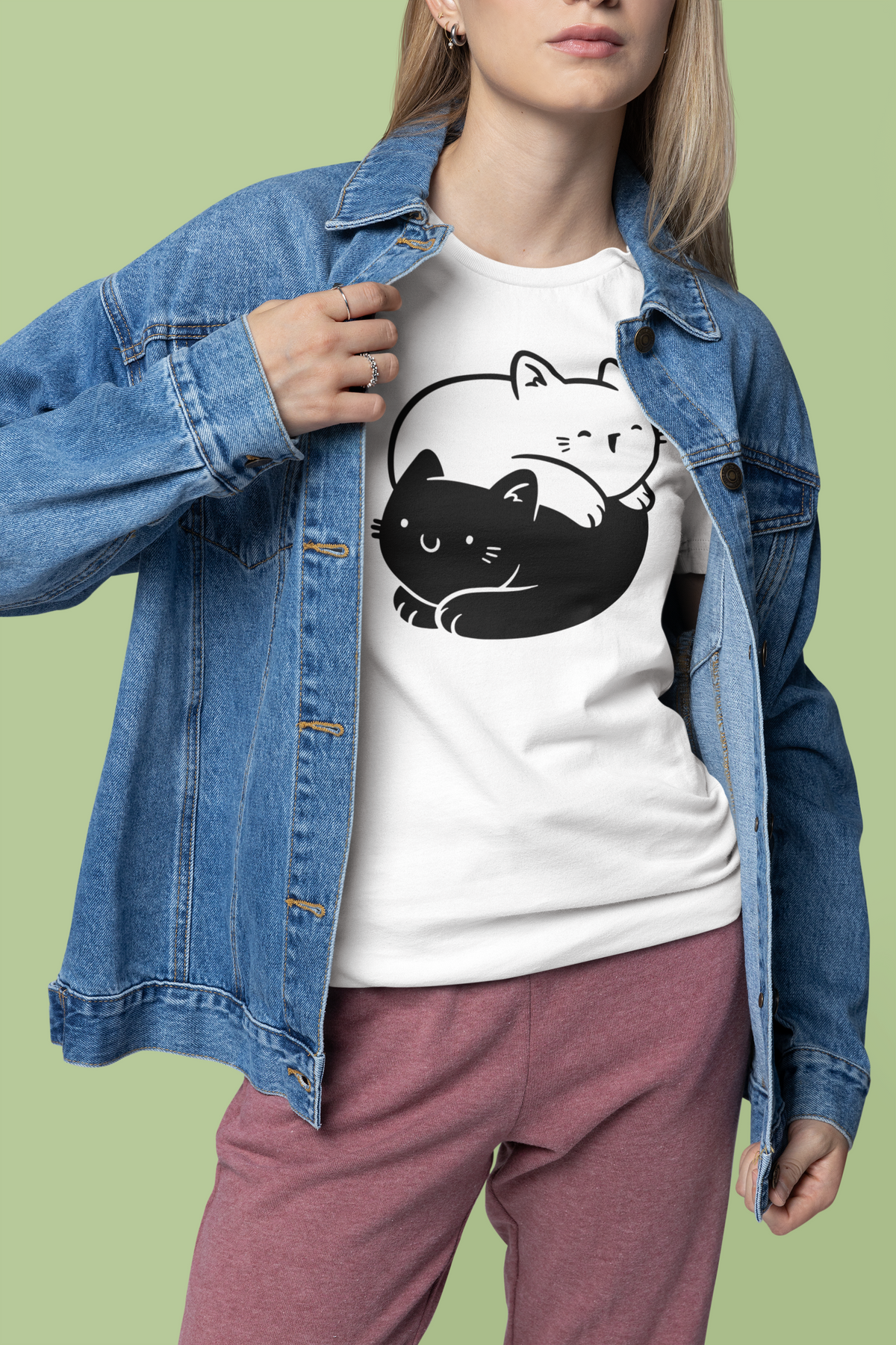 Yin Yang Cats T-shirt in white, woman wearing it with a denim jacket, cute gift for cat lovers