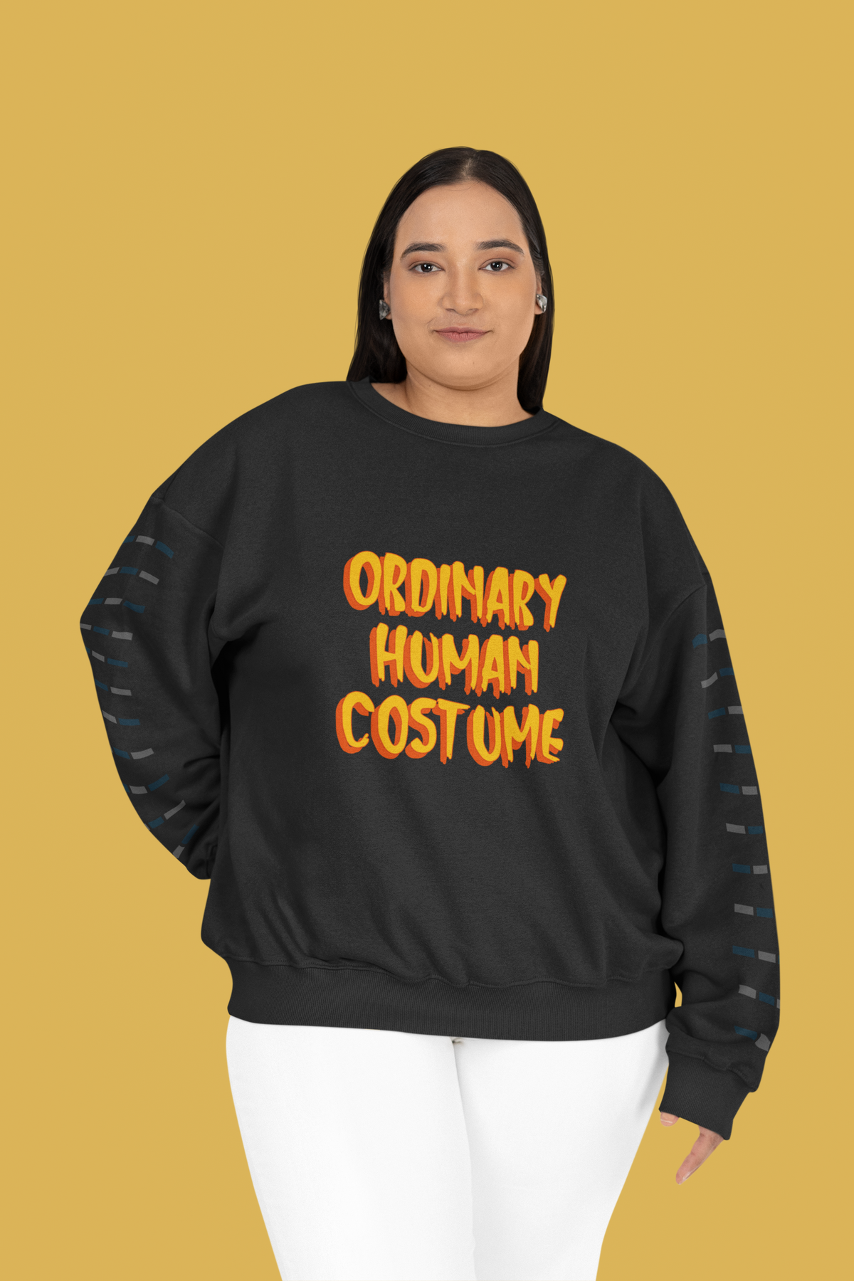 'Ordinary Human Costume' funny halloween sweatshirt in black, woman wearing it, yellow background, gift
