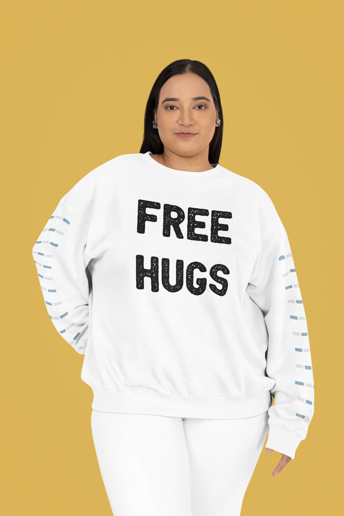 'Free Hugs' sweatshirt in white, woman wearing it on mustard backdrop, funny sarcastic gift