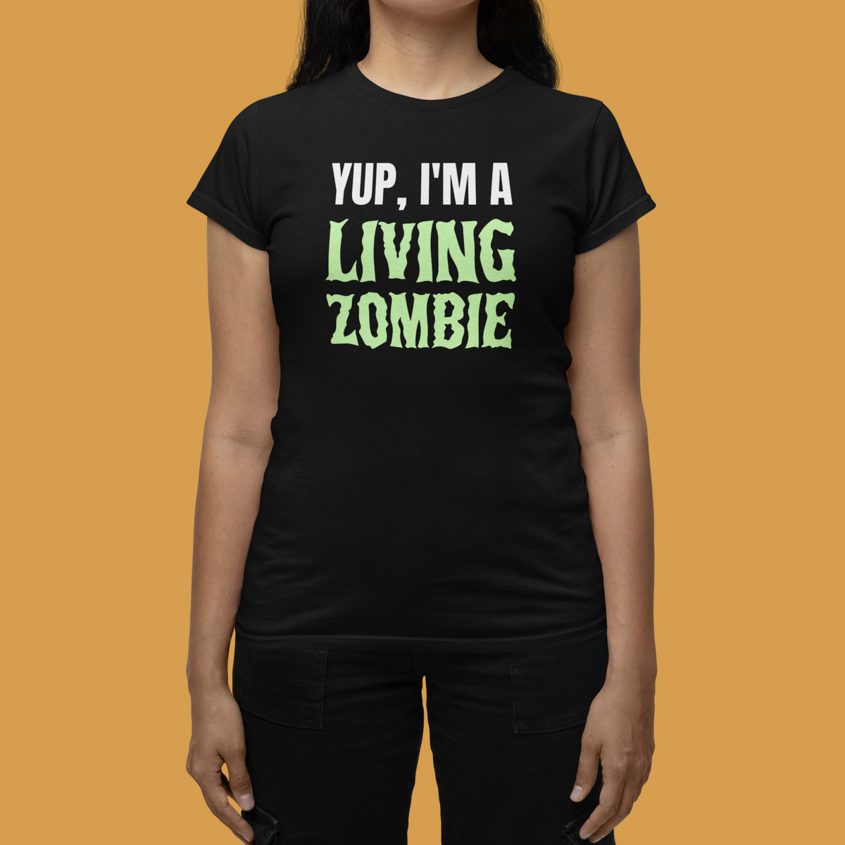'Yup, I'm a Living Zombie' women's tee in black, woman wearing it in studio, funny zombie shirt gift