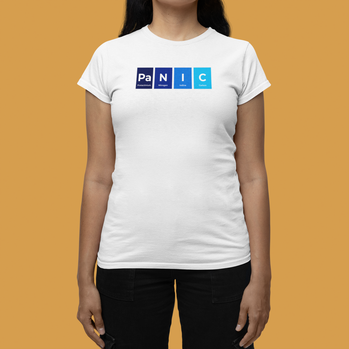 'Pa-N-I-C' periodic table women's tee in white, woman modeling it on orange background, funny science gift