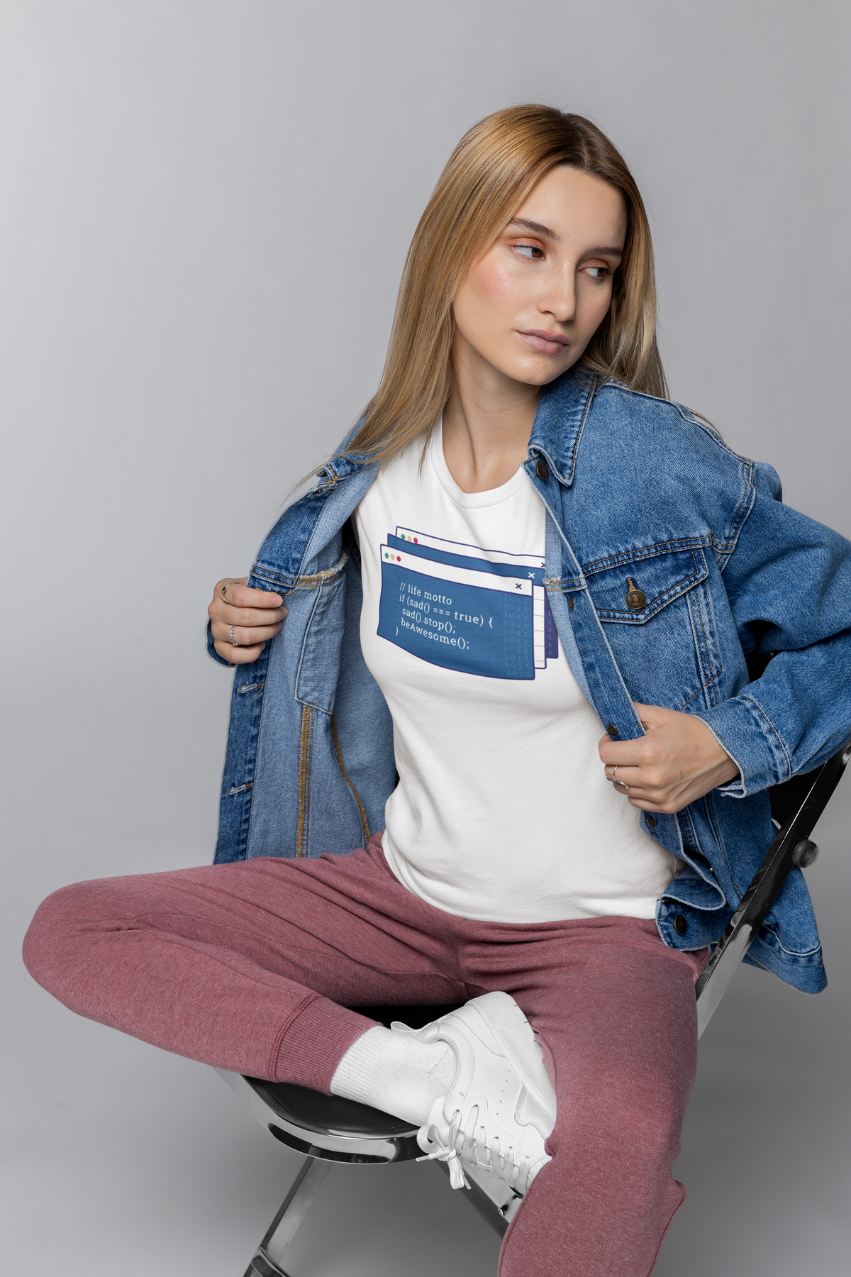 'Coding Is Fun' t-shirt in white, woman model wearing it under an open denim jacket, funny developer gift