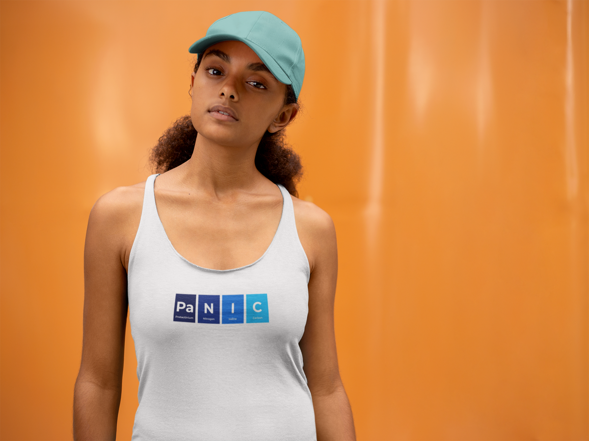 'Pa-N-I-C Periodic Table Women's Tank' in white, woman by an orange wall, Tank Top mockup, Geekpsters