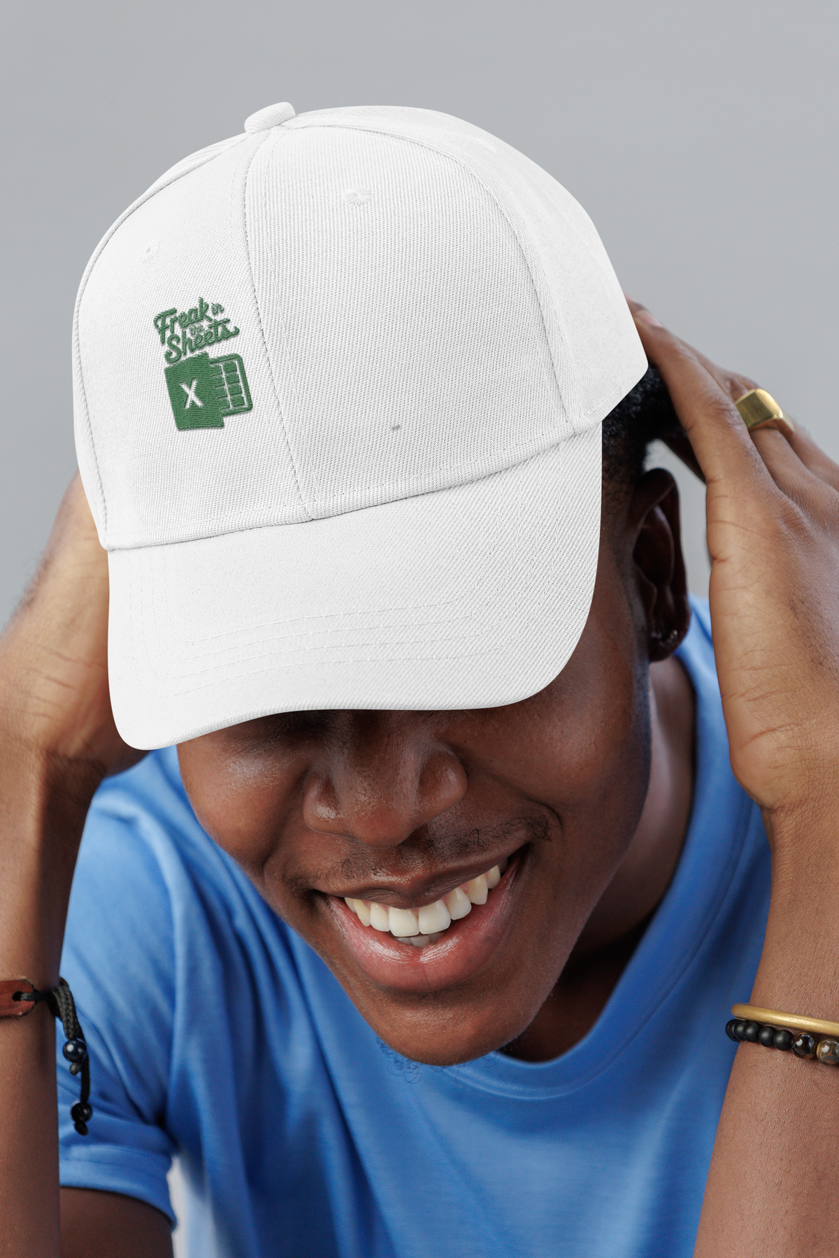 Freak In The Sheets spreadsheet dad hat, smiling man in a studio, lifestyle mockup, Geekpsters