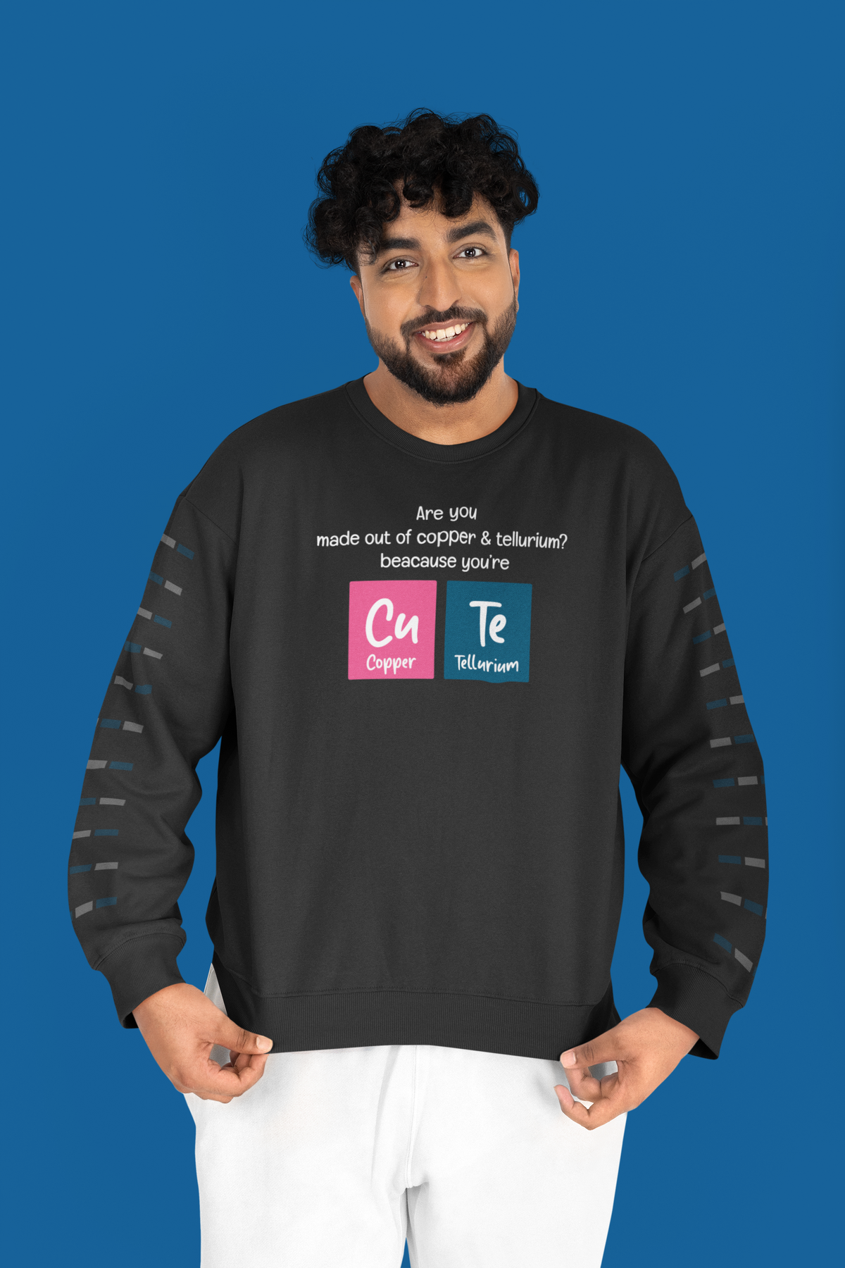 Cu-Te periodic table cute pun crewneck sweatshirt in black, flat lay with the graphic centered