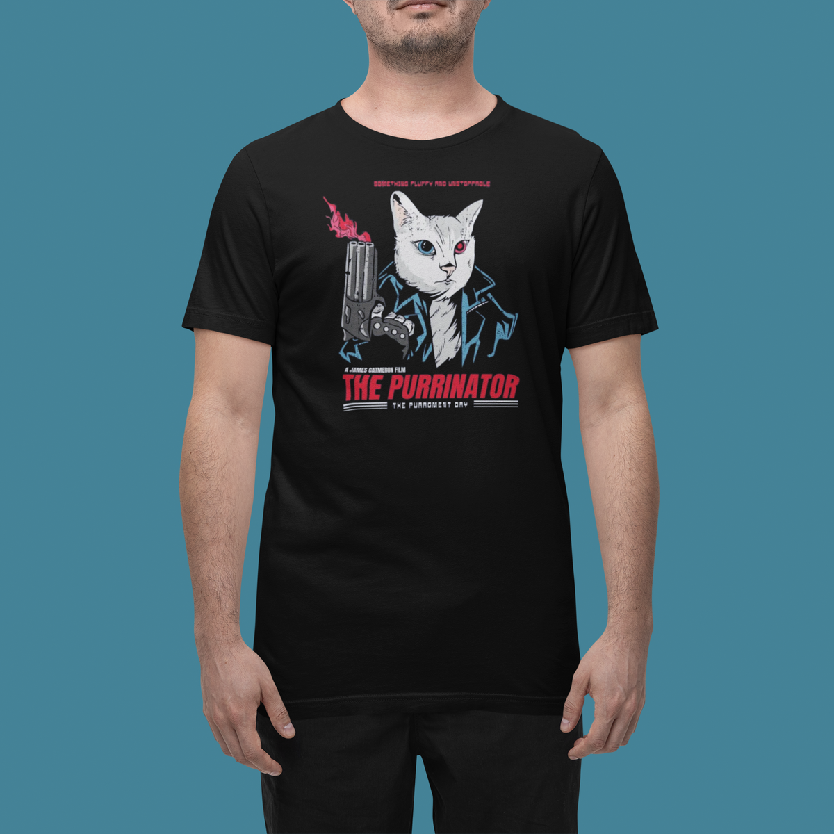 'The Purrymatore' t-shirt in black, man wearing it in a studio, T-Shirt mockup, Geekpsters