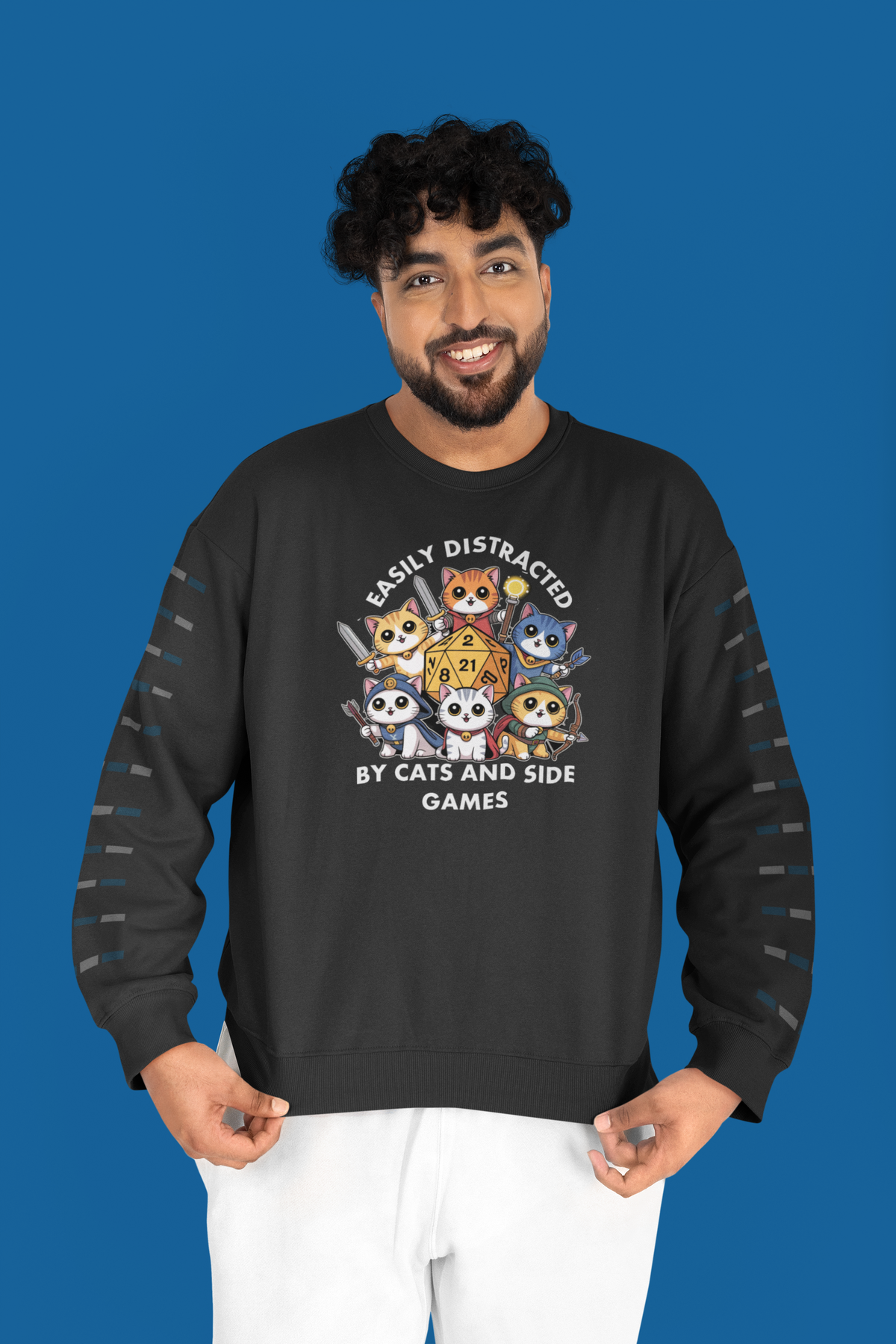 'Easily Distracted by Cats and Side Games' sweatshirt in black, man standing on blue background, gift
