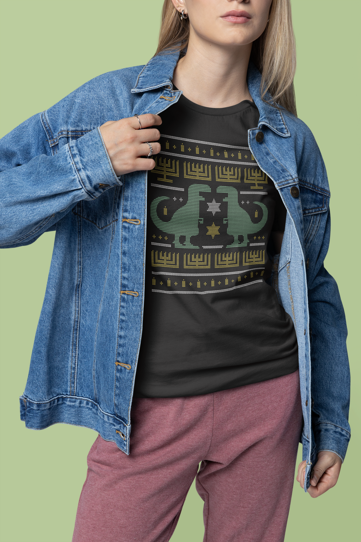 Dino Ugly Sweater T-shirt in charcoal, woman wearing it with a denim jacket, funny holiday gift