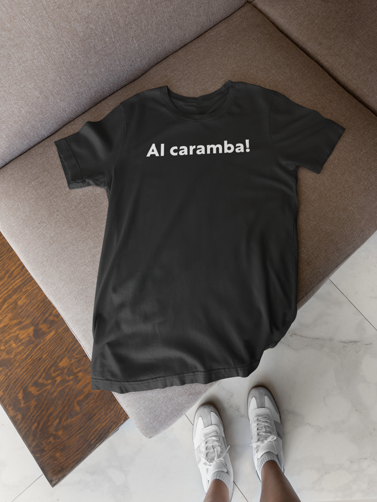 'AI Caramba!' t-shirt in black, flat lay with sneakers, funny gift for tech enthusiasts