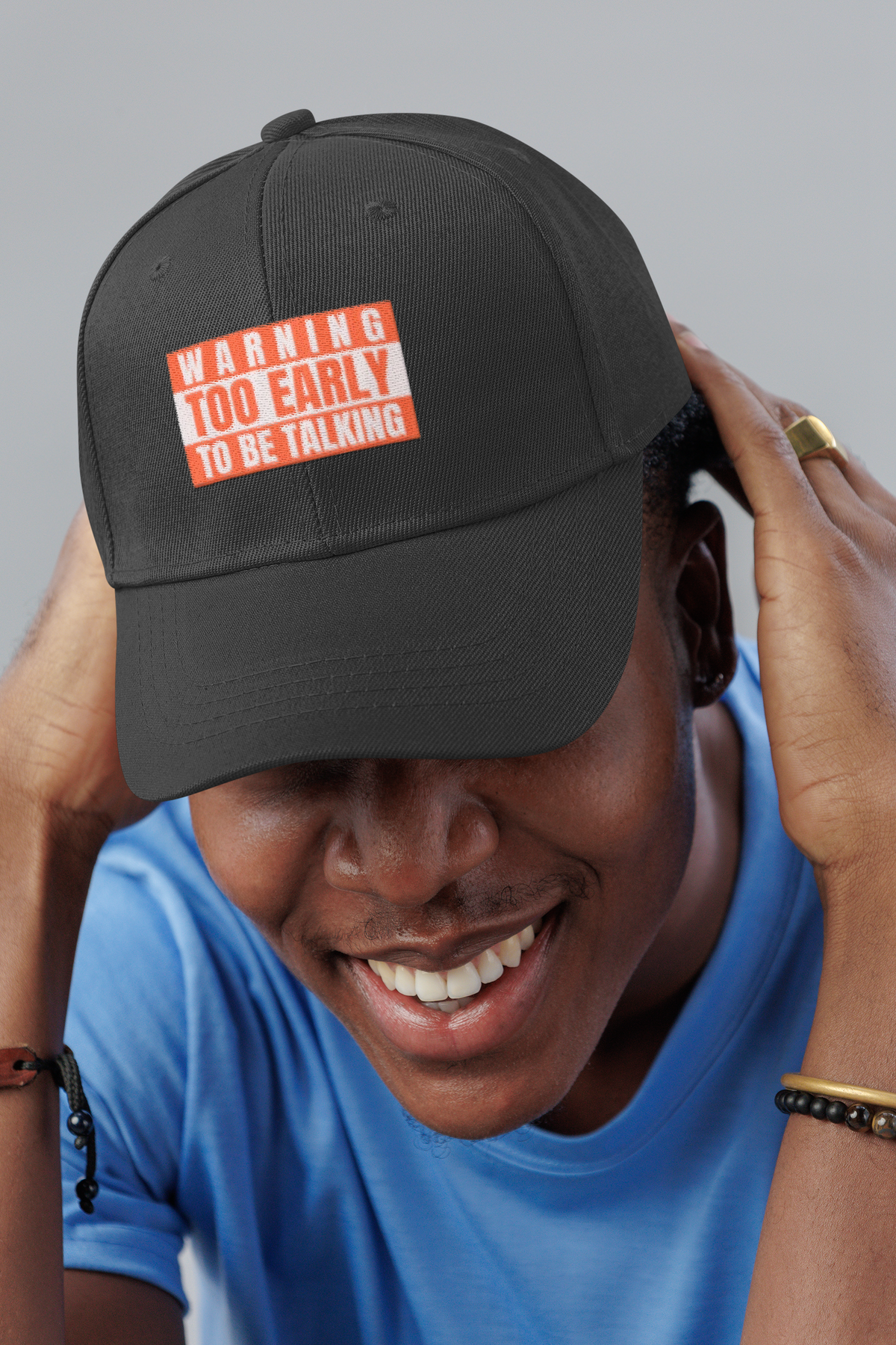 Too Early To Be Talking introvert dad hat, smiling man in a studio, lifestyle mockup, Geekpsters
