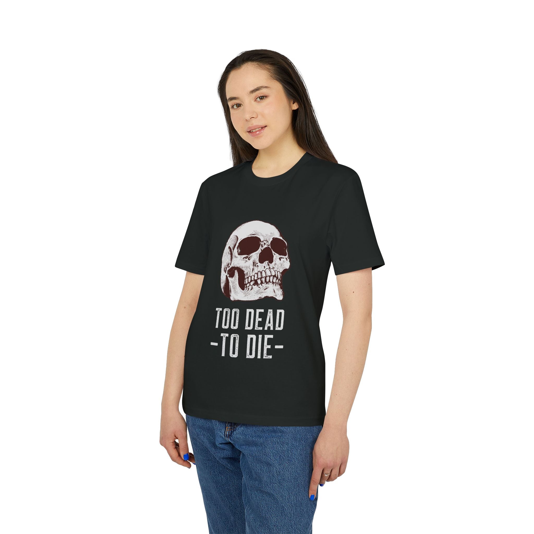 Someone wears the Skull Death - Organic T-Shirt, made of organic cotton in black, with a bold skull graphic and "TOO DEAD TO DIE" printed below.