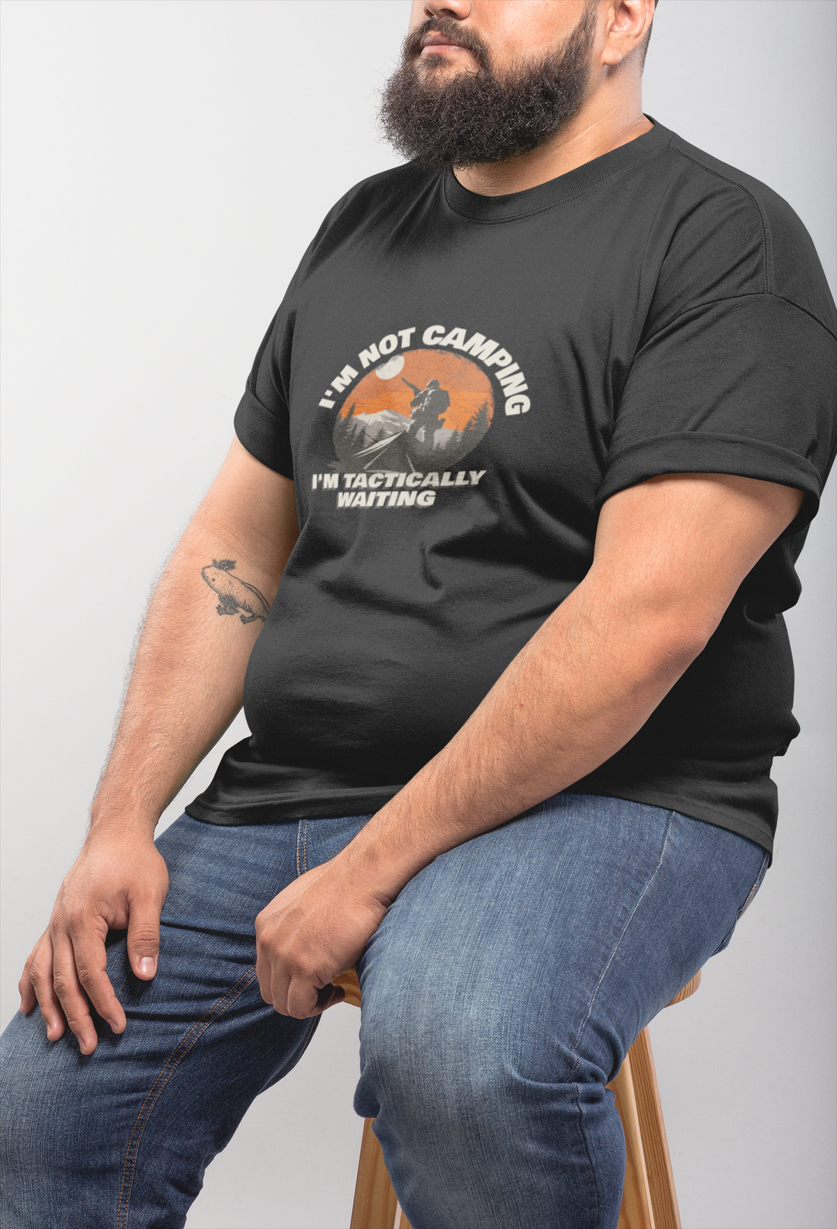 'I'm Not Camping' hiker graphic t-shirt in charcoal, bearded man wearing it, funny outdoor pun gift