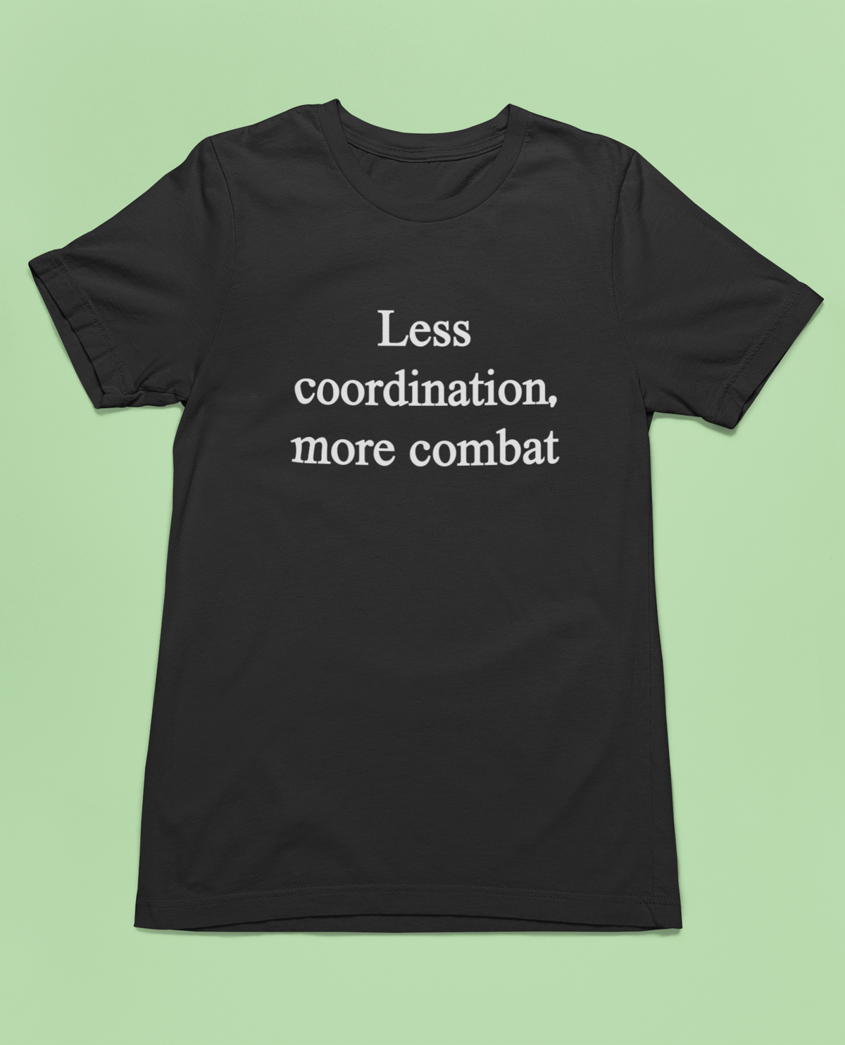 'Less Coordination More Combat' t-shirt in black, woman standing on teal background, funny office gift