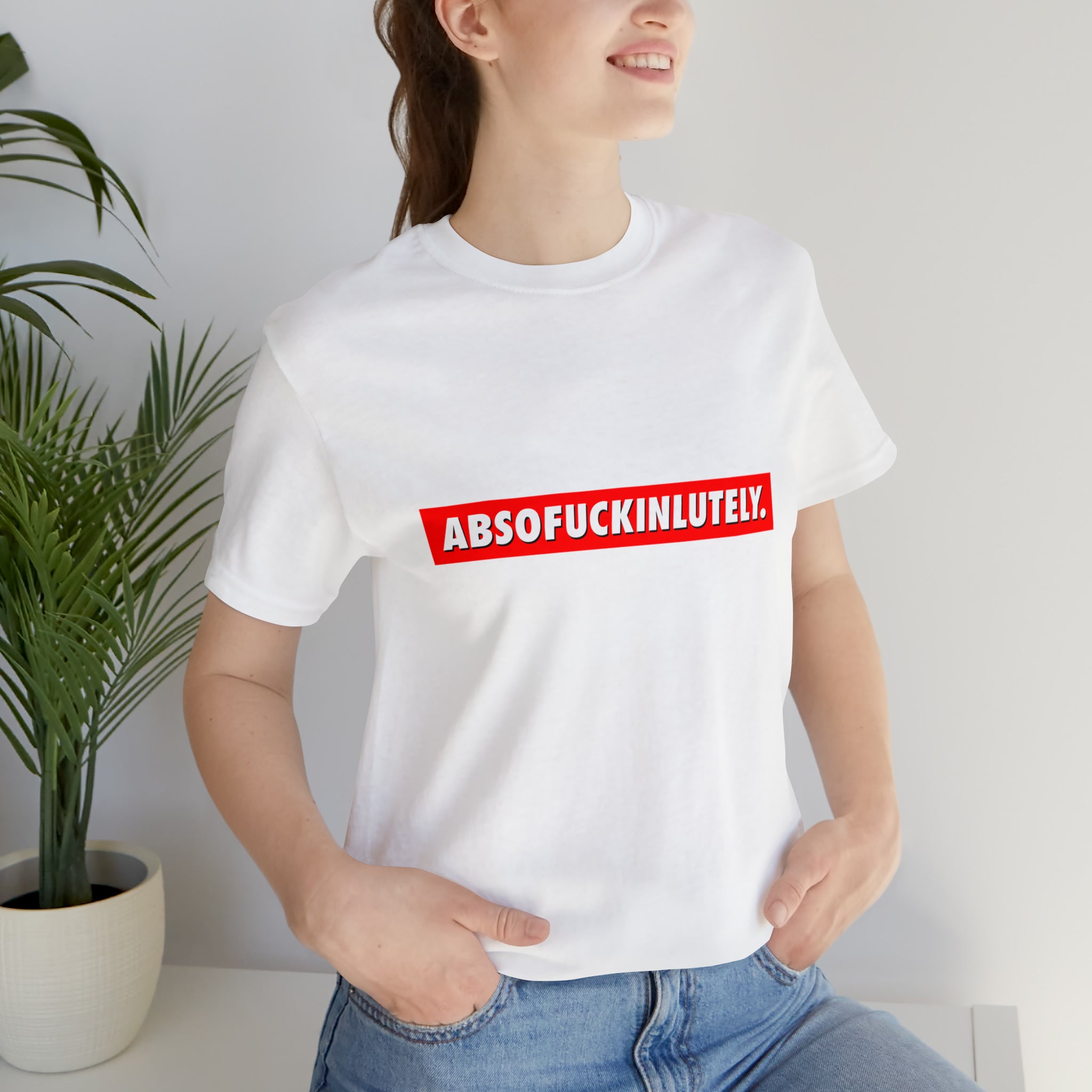 An eye-catching woman in a bold white Absofuckinlutely T-Shirt.