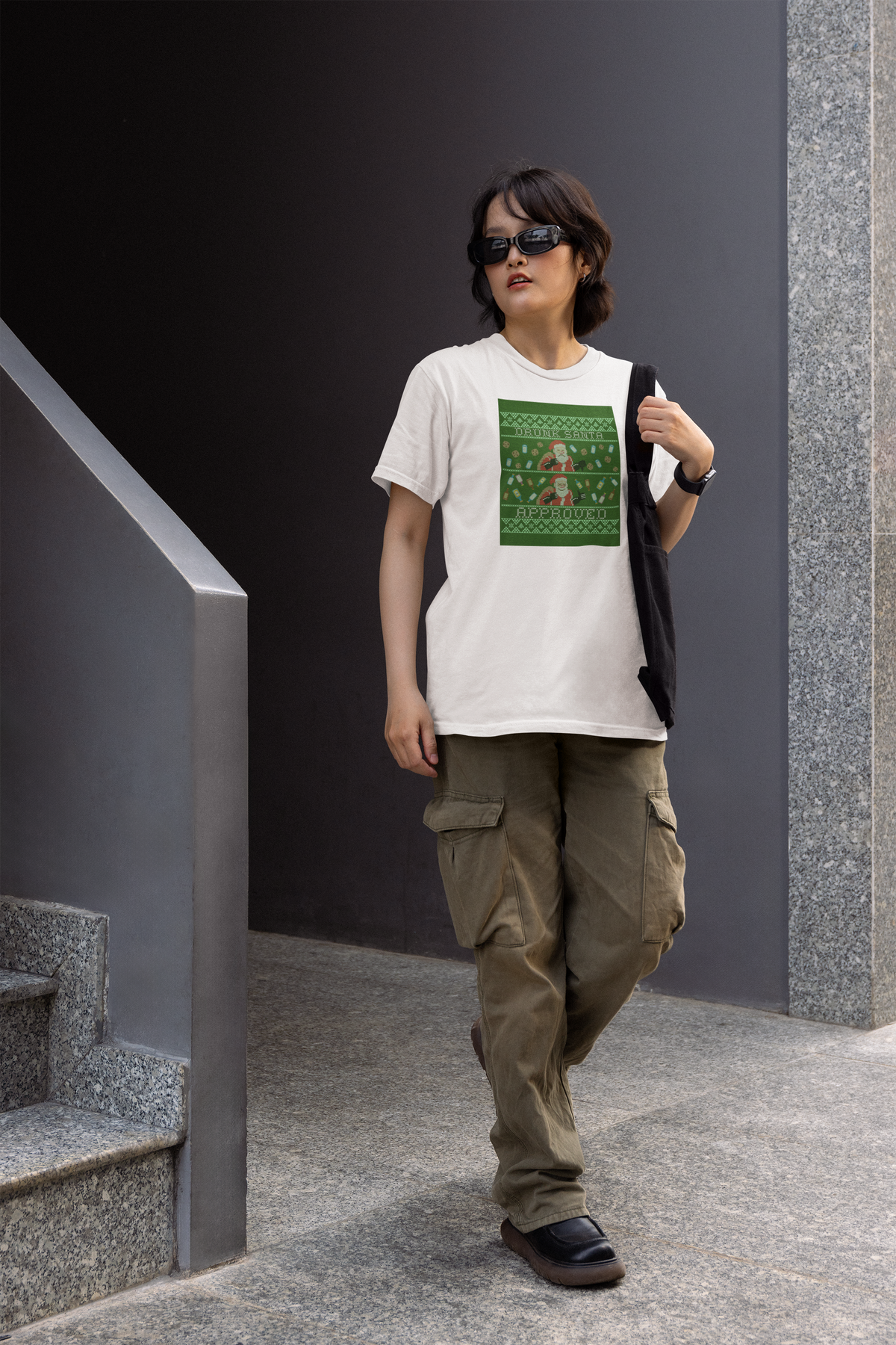 'Drunk Santa Approved' Santa graphic women's tee in white, woman walking in urban setting, funny Christmas gift