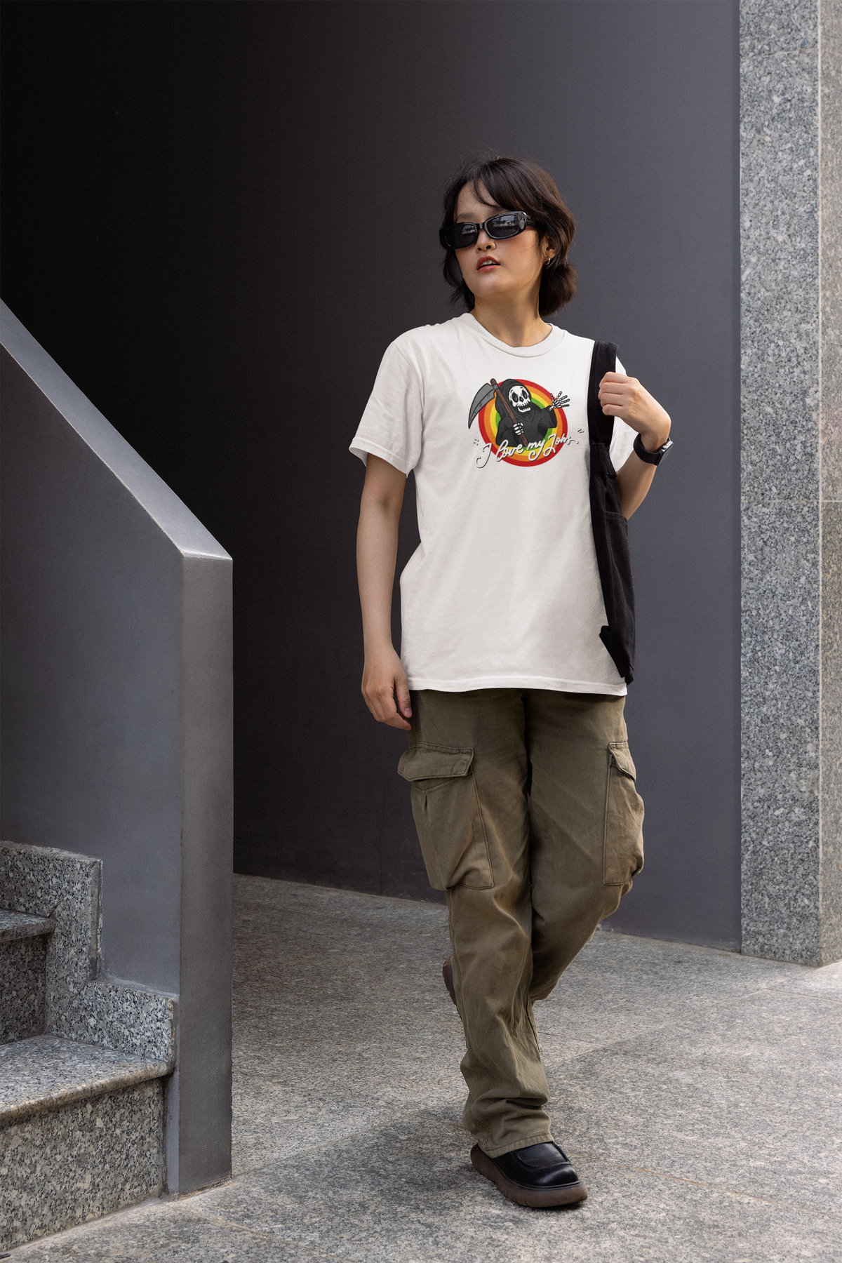 "I Love My Job" grim reaper tee in white, man walking wearing it in cargo pants, funny gift