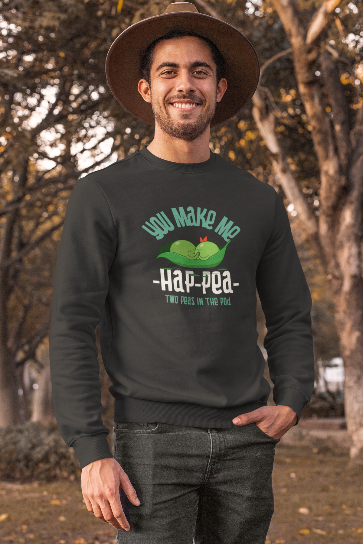 'You Make Me Ha-Pea' pea pun sweatshirt in black, man wearing it outdoors, funny vegetable pun gift