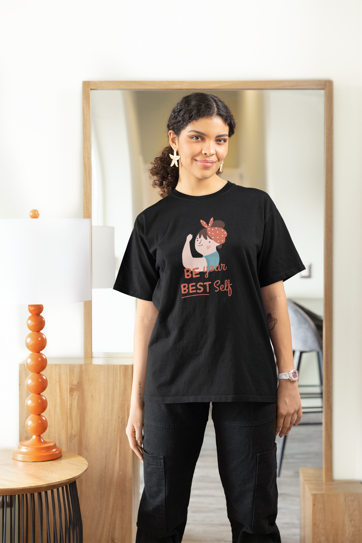 Be Your Best Self Women's T-Shirt in black, woman wearing it indoors, motivational gift