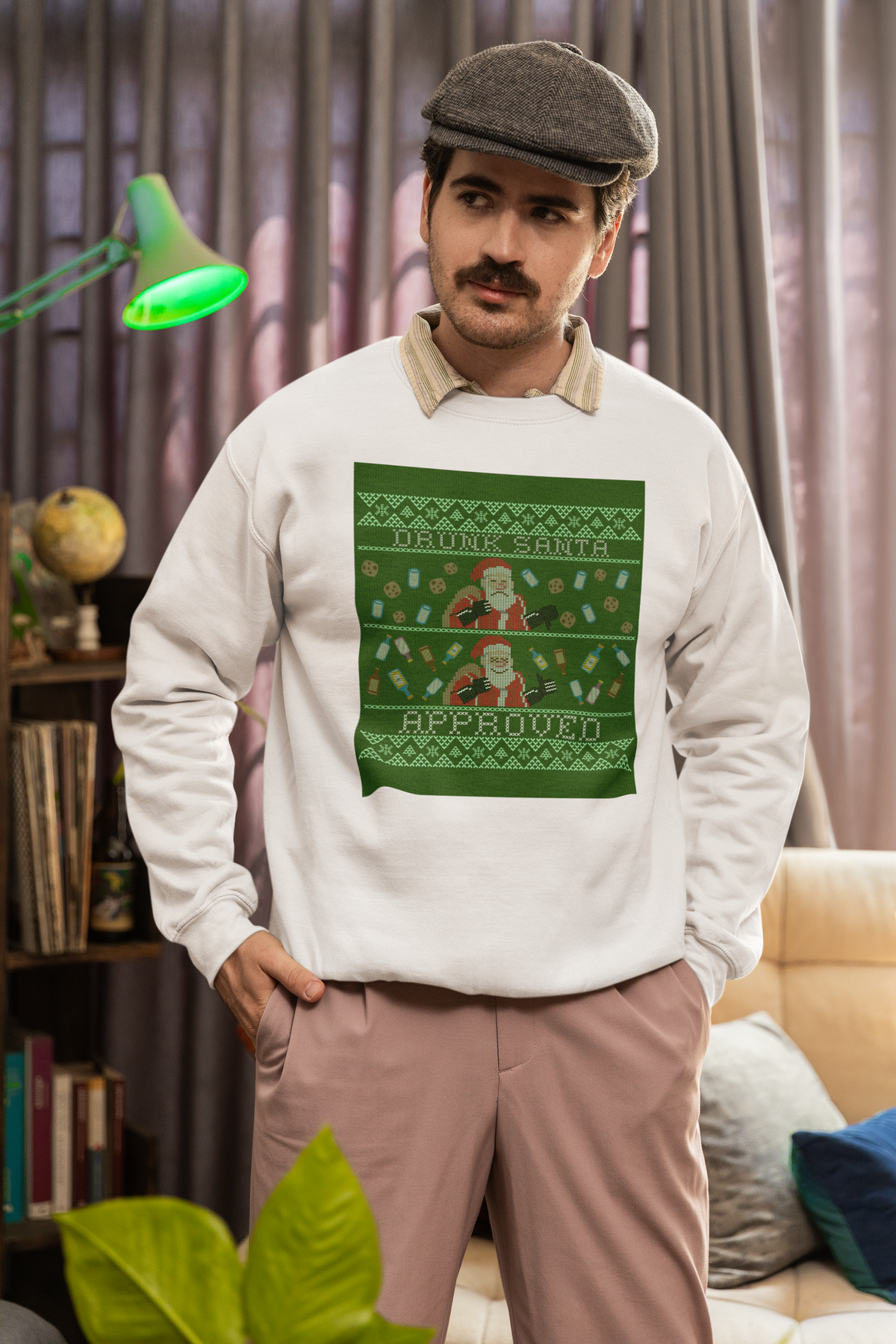 'Drunk Santa Approved' ugly christmas sweatshirt in cream, man wearing it indoors, funny holiday gift
