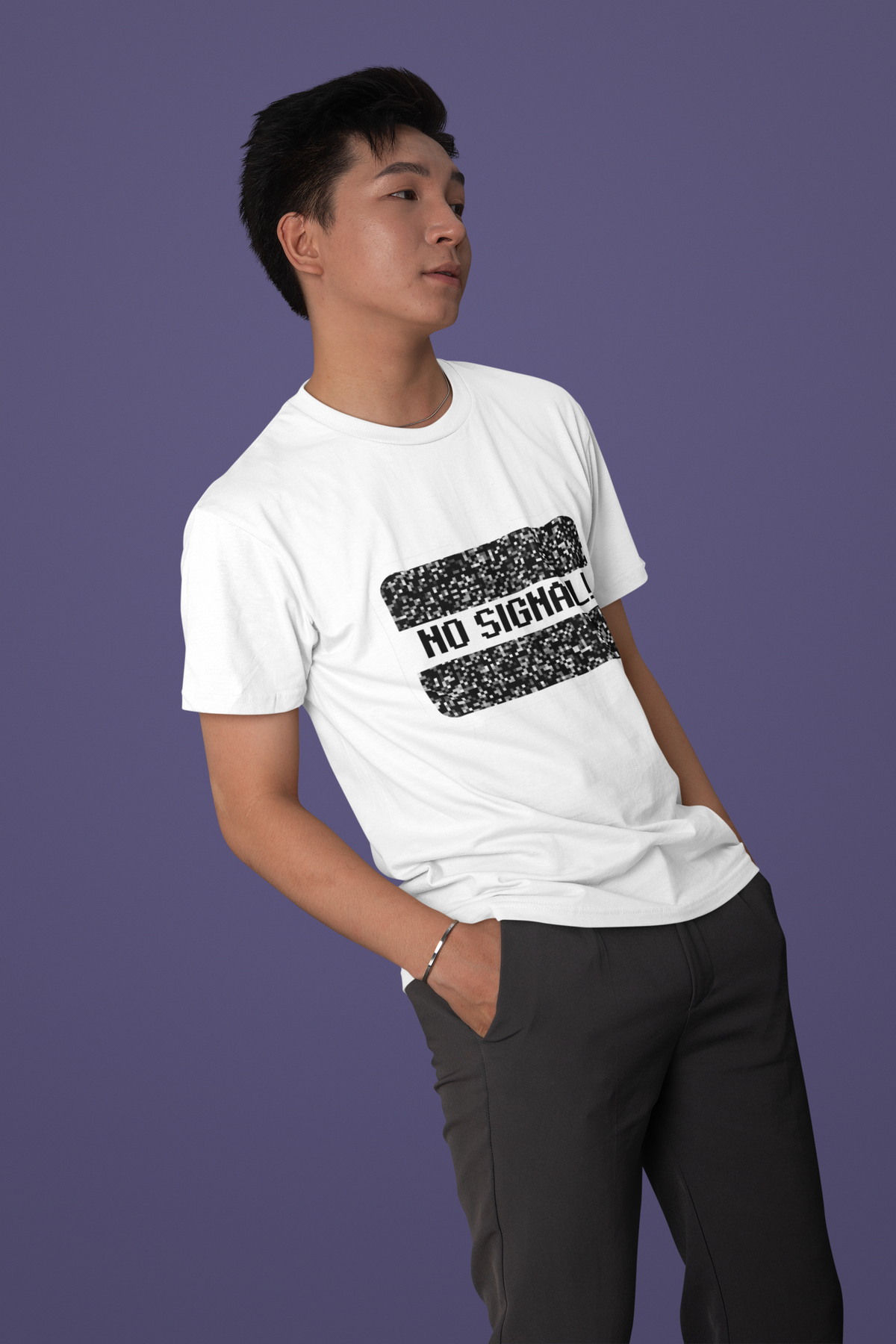 'No Signal' graphic t-shirt in white, man wearing it against purple backdrop, funny retro TV shirt