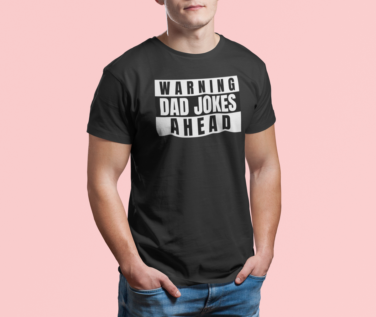 'Warning Dad Jokes Ahead' t-shirt in black, man wearing it on pink backdrop, funny gift for dad