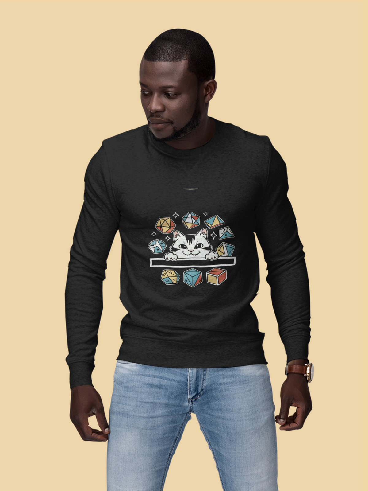 'Cat Dice' sweatshirt in black, man wearing it against a tan backdrop, funny tabletop gamer crewneck gift