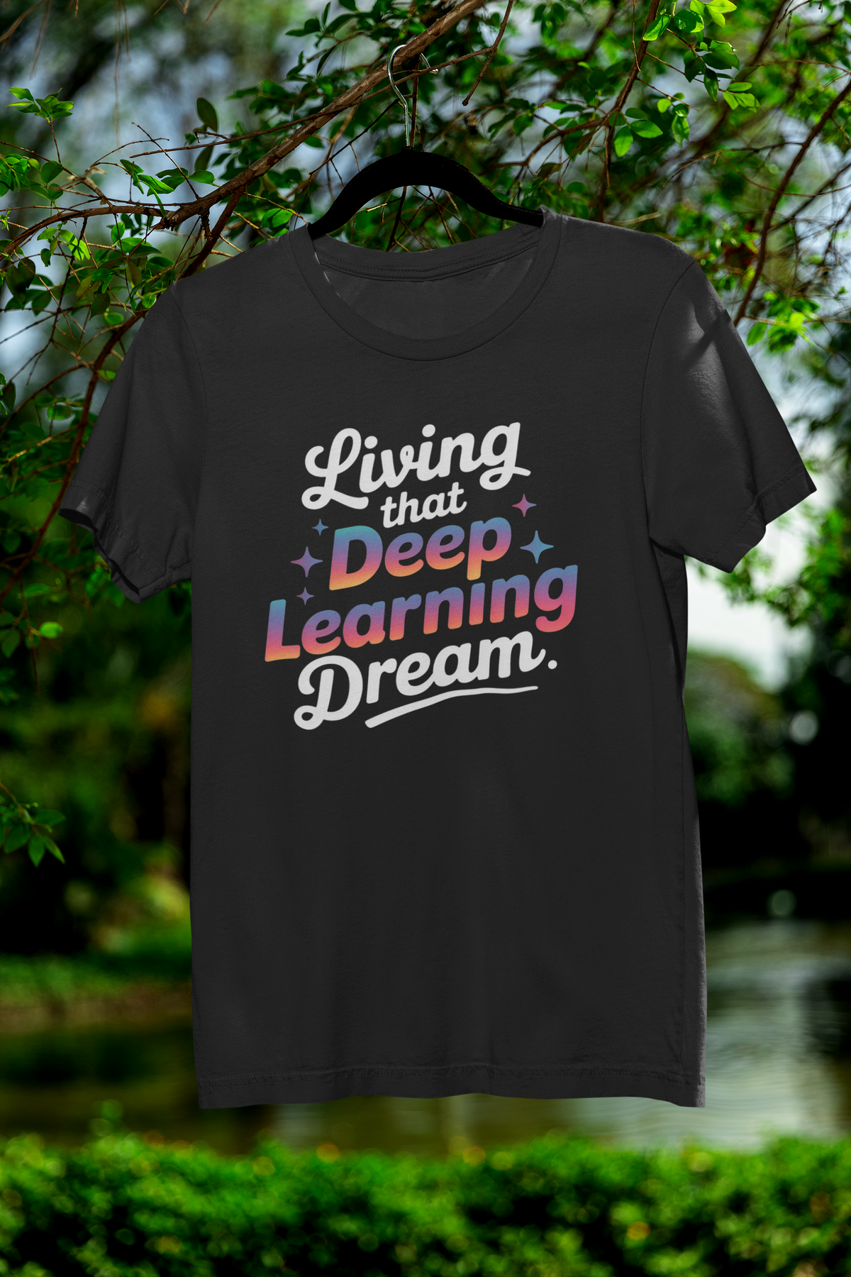 'Living that Deep Learning Dream' tee in black, hanging on a hanger outdoors, funny gift for coders