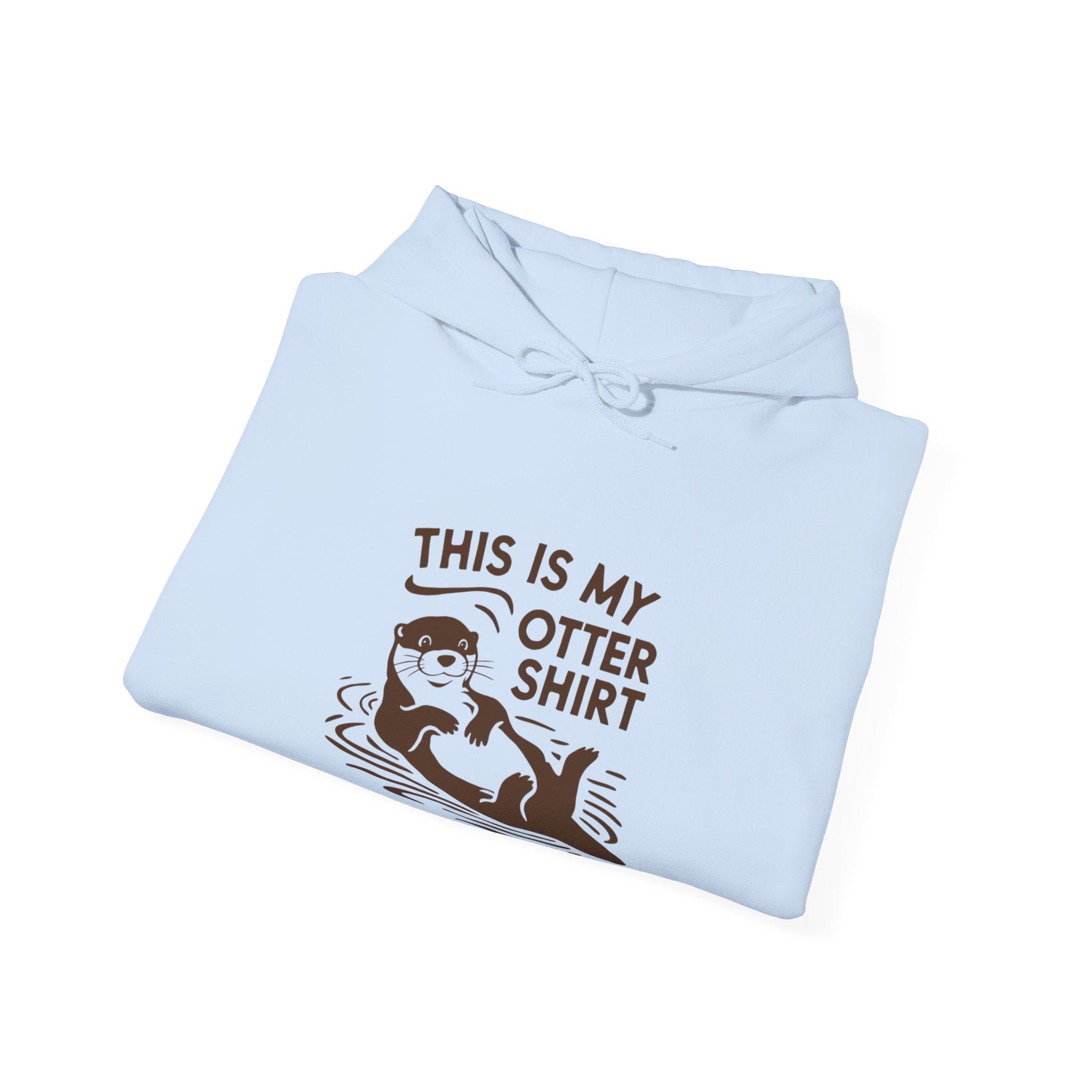 Light blue My Otter Shirt - Hooded Sweatshirt with a classic fit featuring an illustration of an otter lying on its back, surrounded by water, and the text "THIS IS MY OTTER SHIRT" printed in brown.