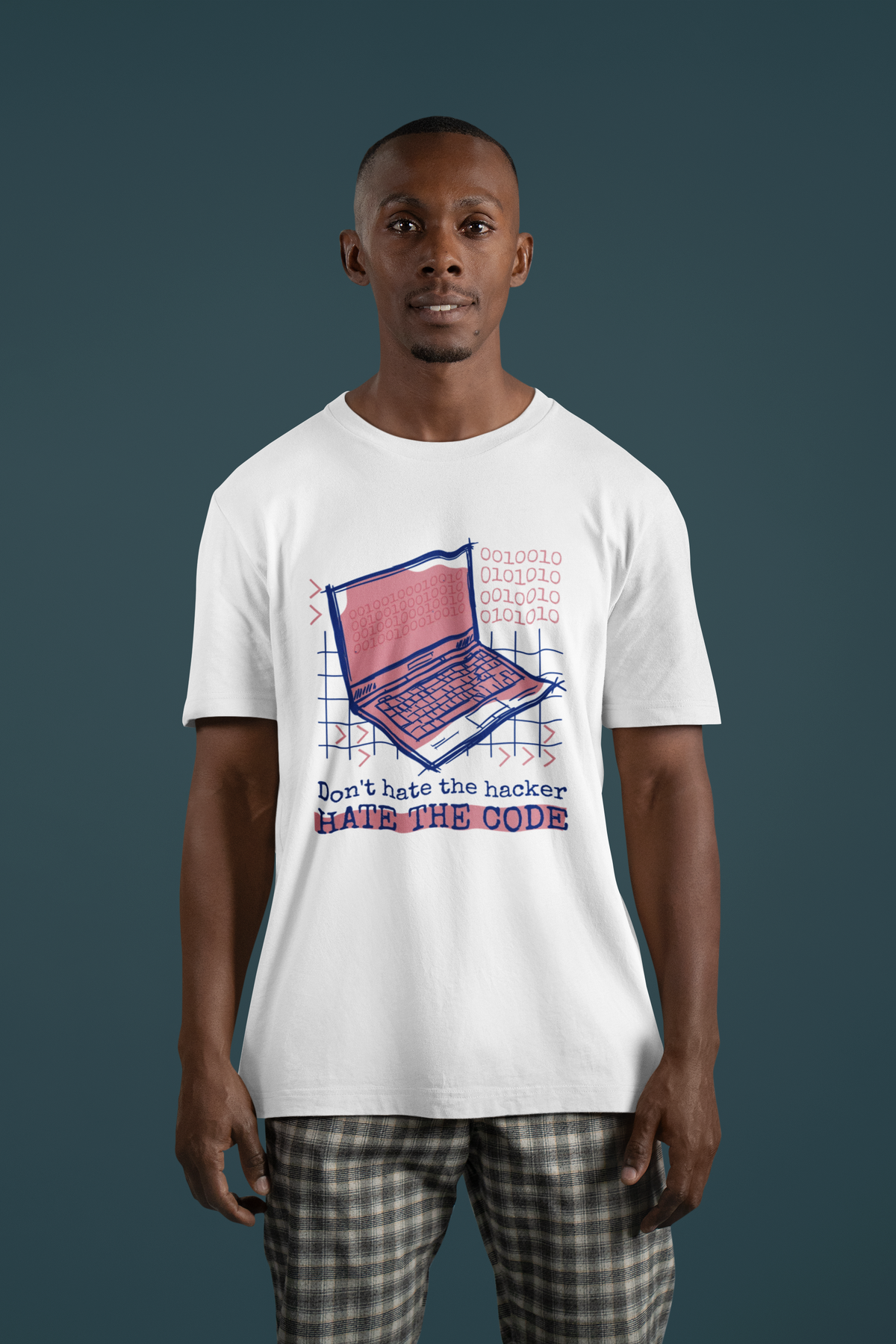 'Don't Hate the Hacker, Hate the Code' laptop t-shirt in white, man model wearing it in plaid pants, coder gift